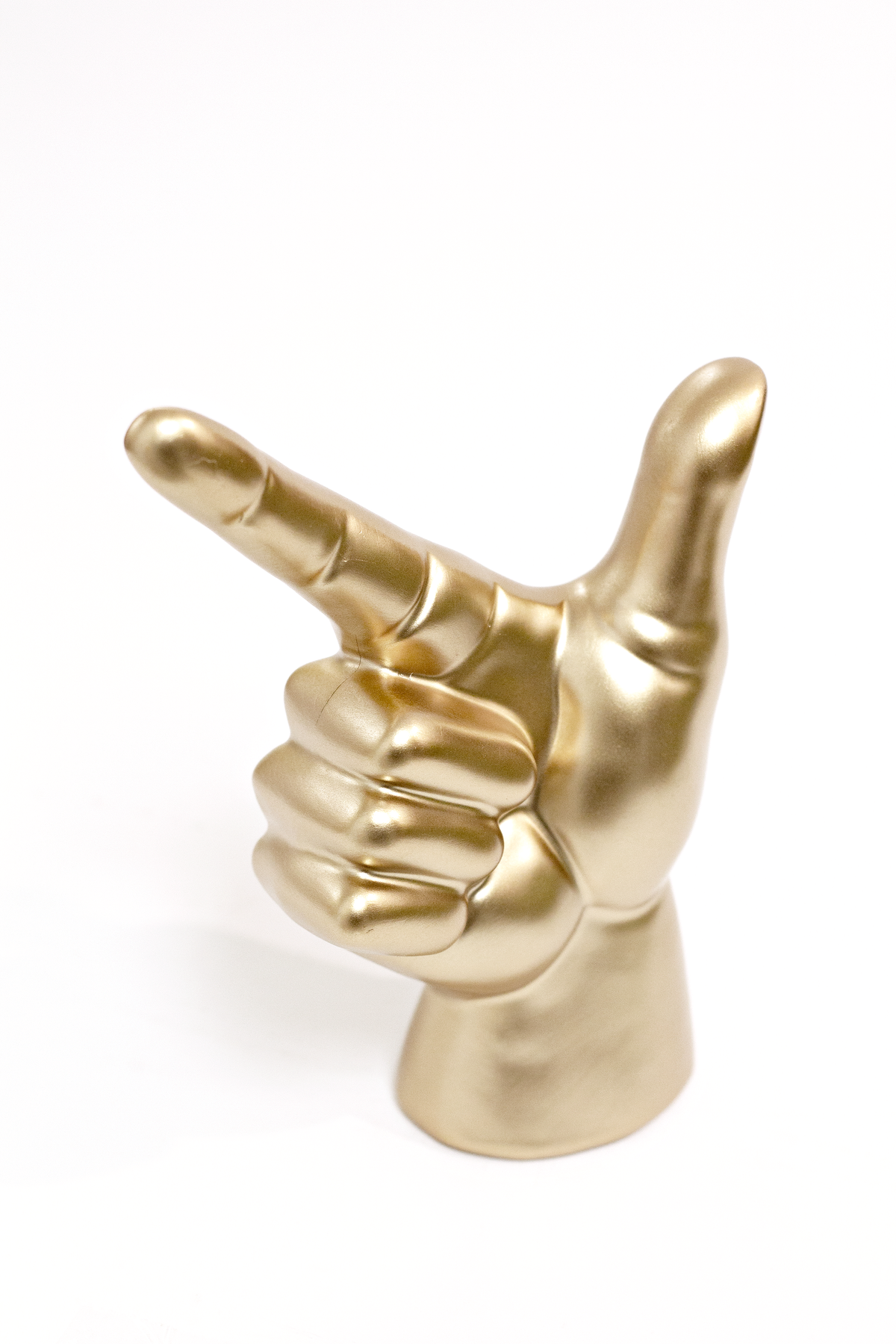 Gold Lucky Hand angled to the left, showing the palm and folded fingers