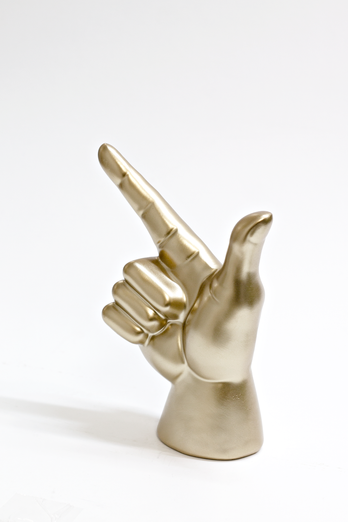 Gold Lucky Hand front on against a soft grey background