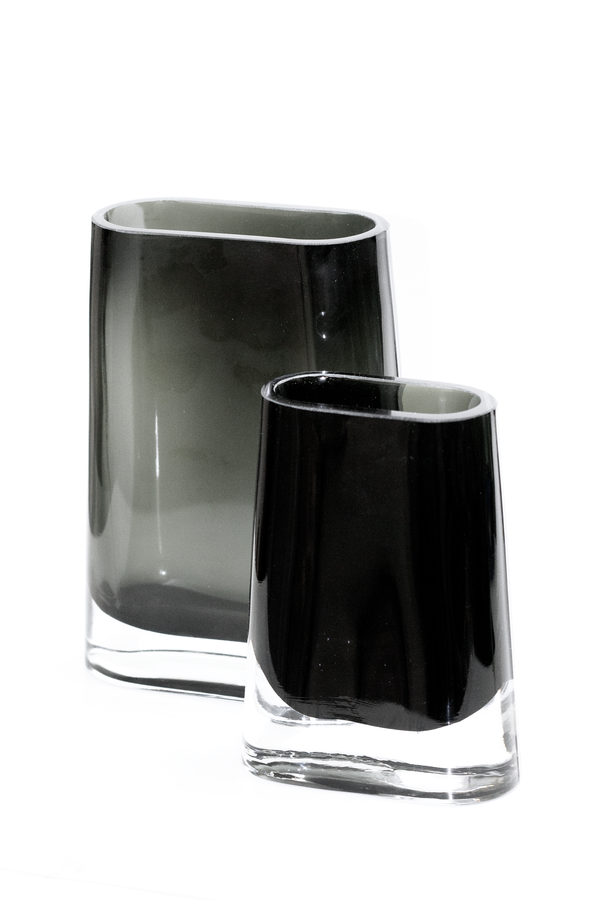 Two small black Lars Glass Vases on a white surface by Flux Home.