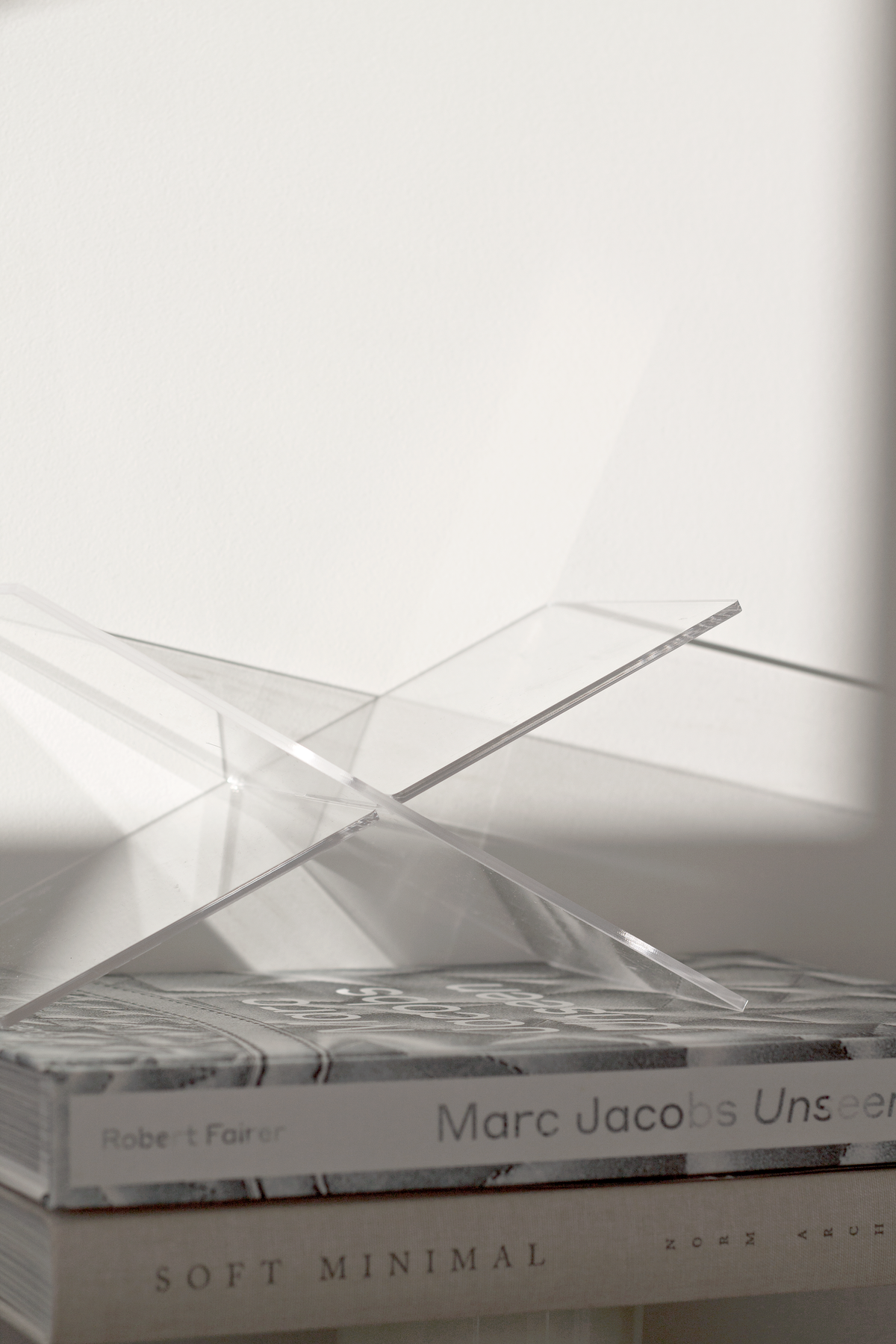 Acrylic book holder flat-packed for storage