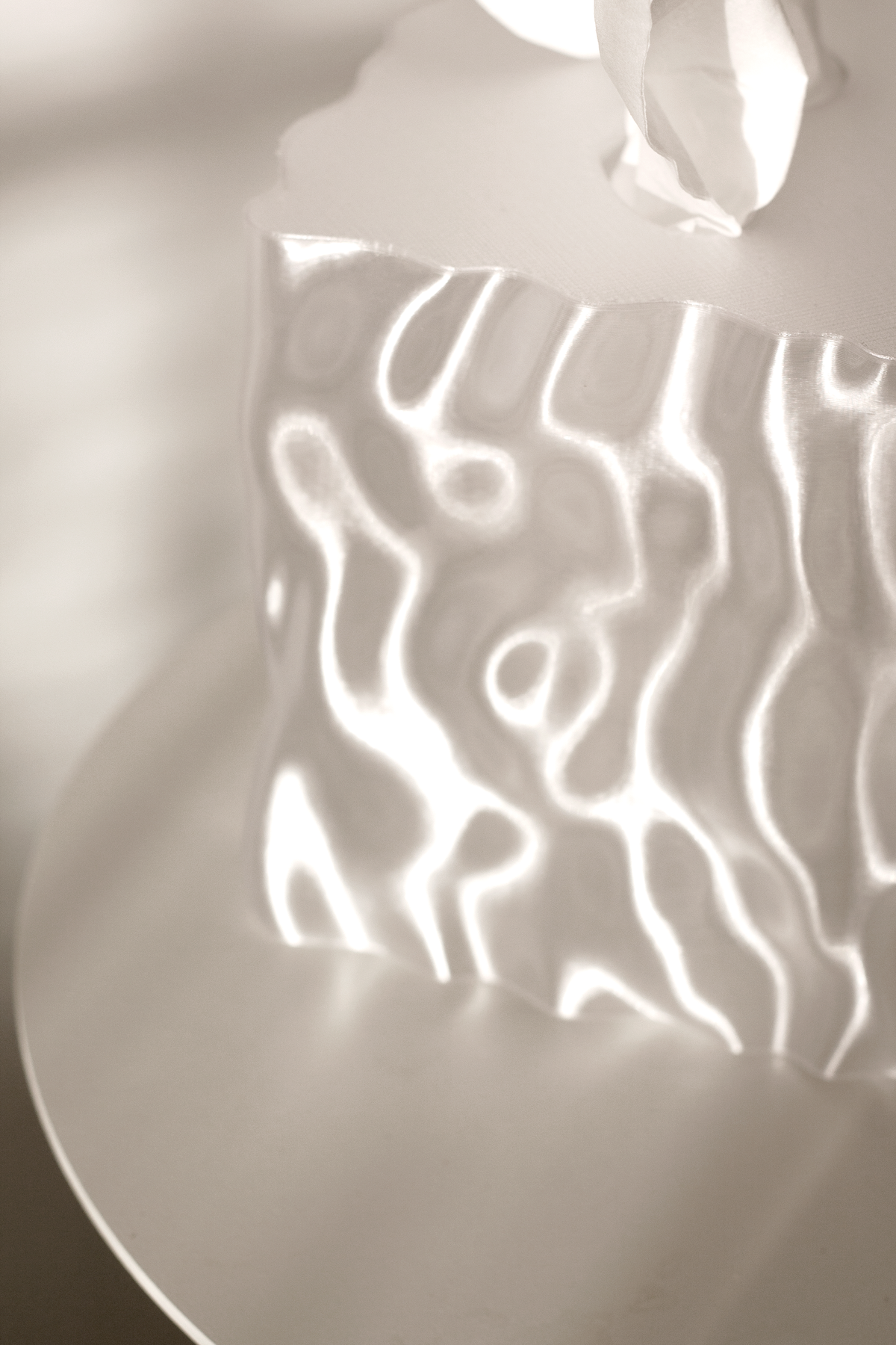 Close-up of a clear Flow cover glowing with rippled light