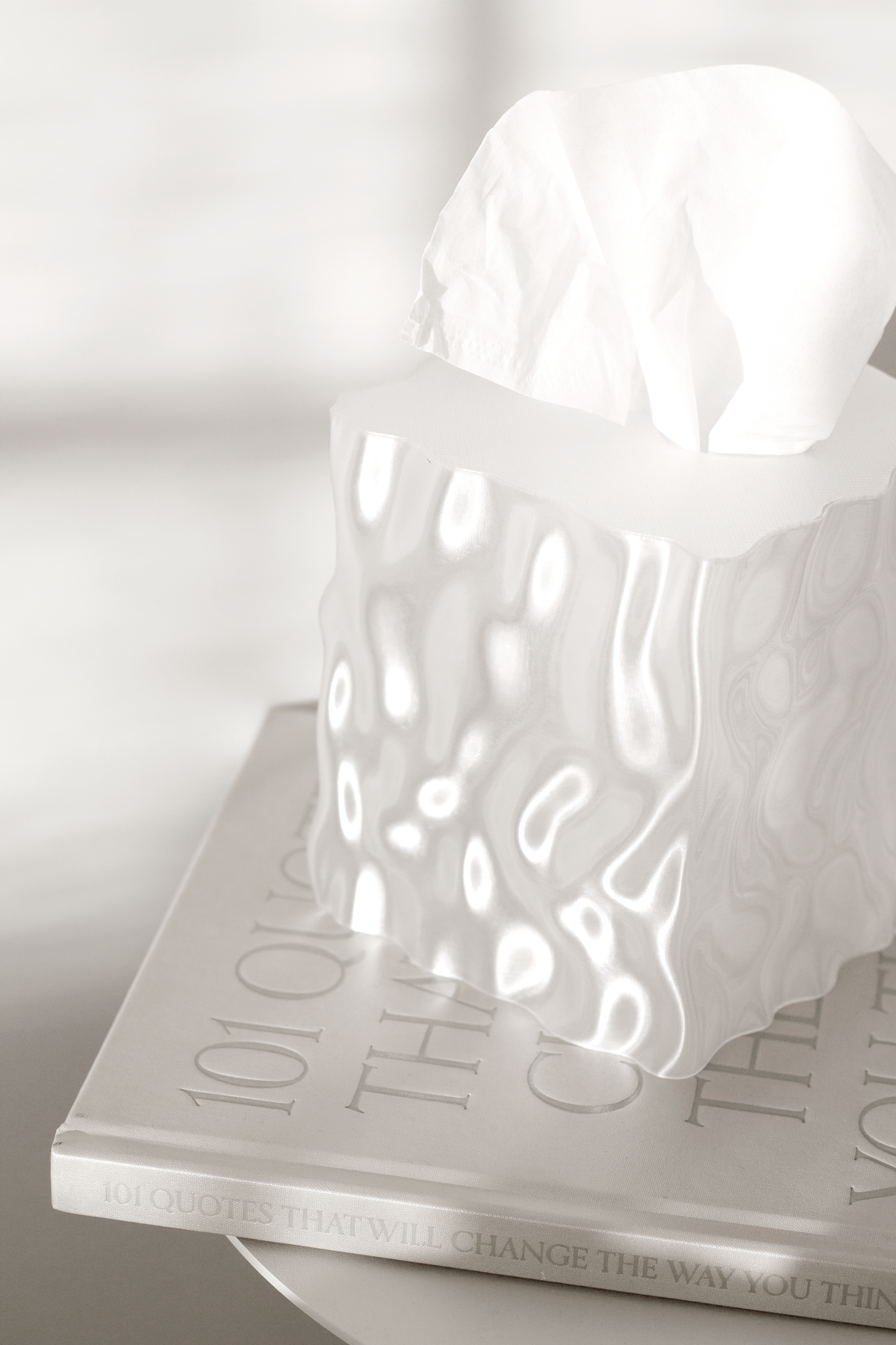 Close view of a clear Flow cover on a book in soft light