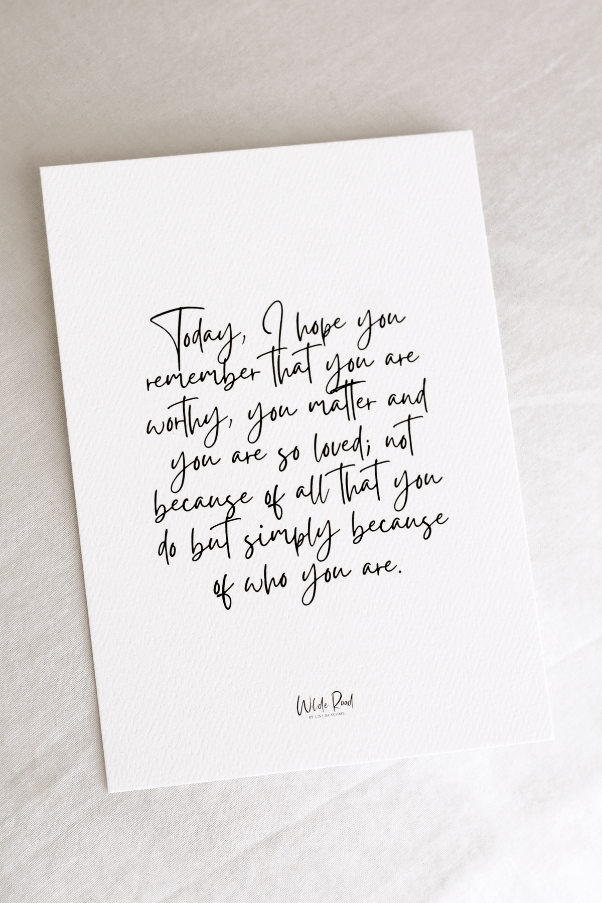 Wilde Road affirmation card displayed on its wooden stand