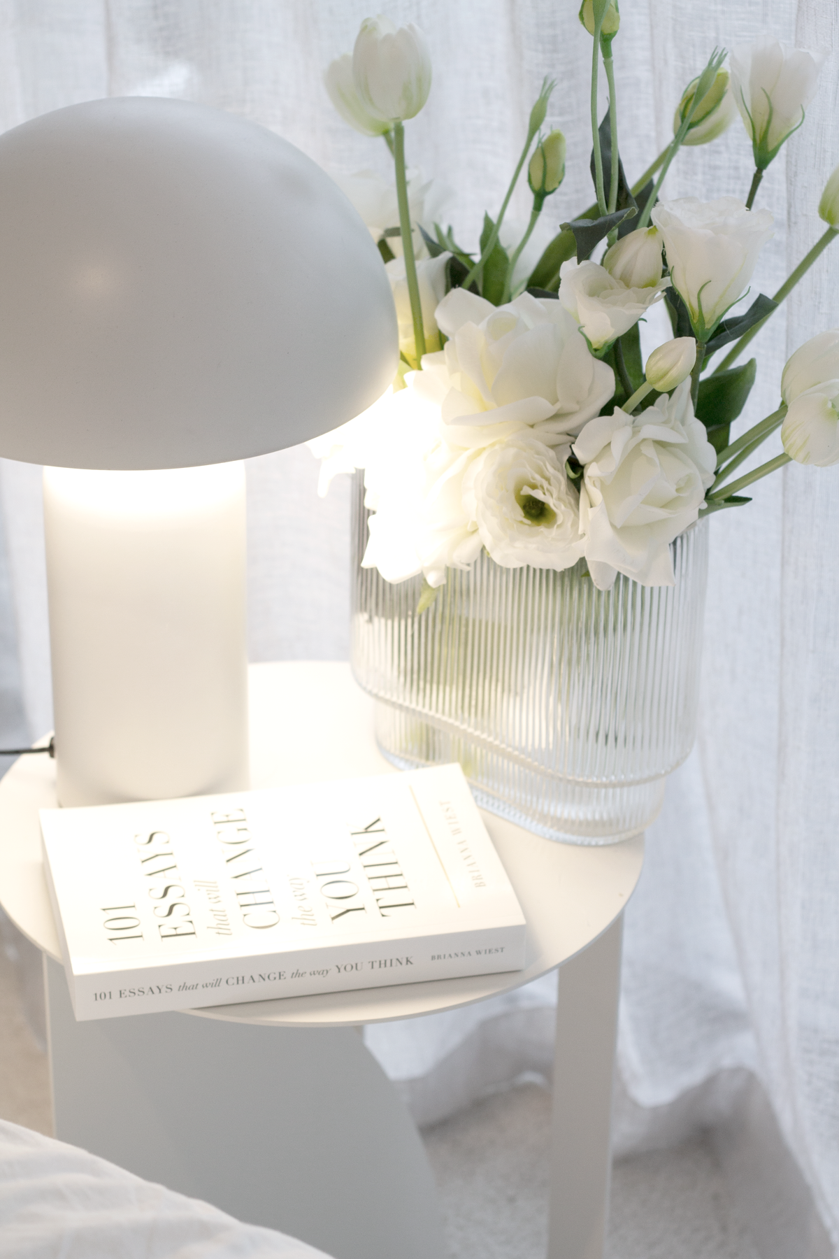Arch Side Table White styled beside an armchair by Made of Tomorrow