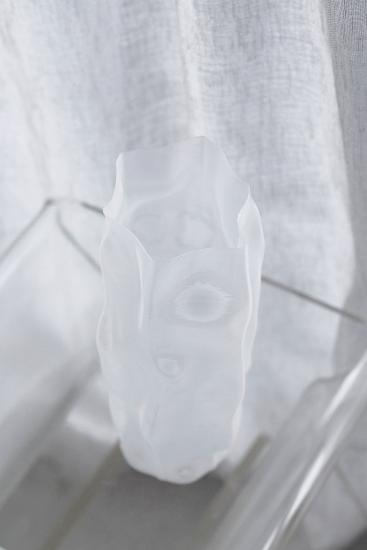 Looking slightly down on the ripple vase, the uneven rim and hollow interior in view