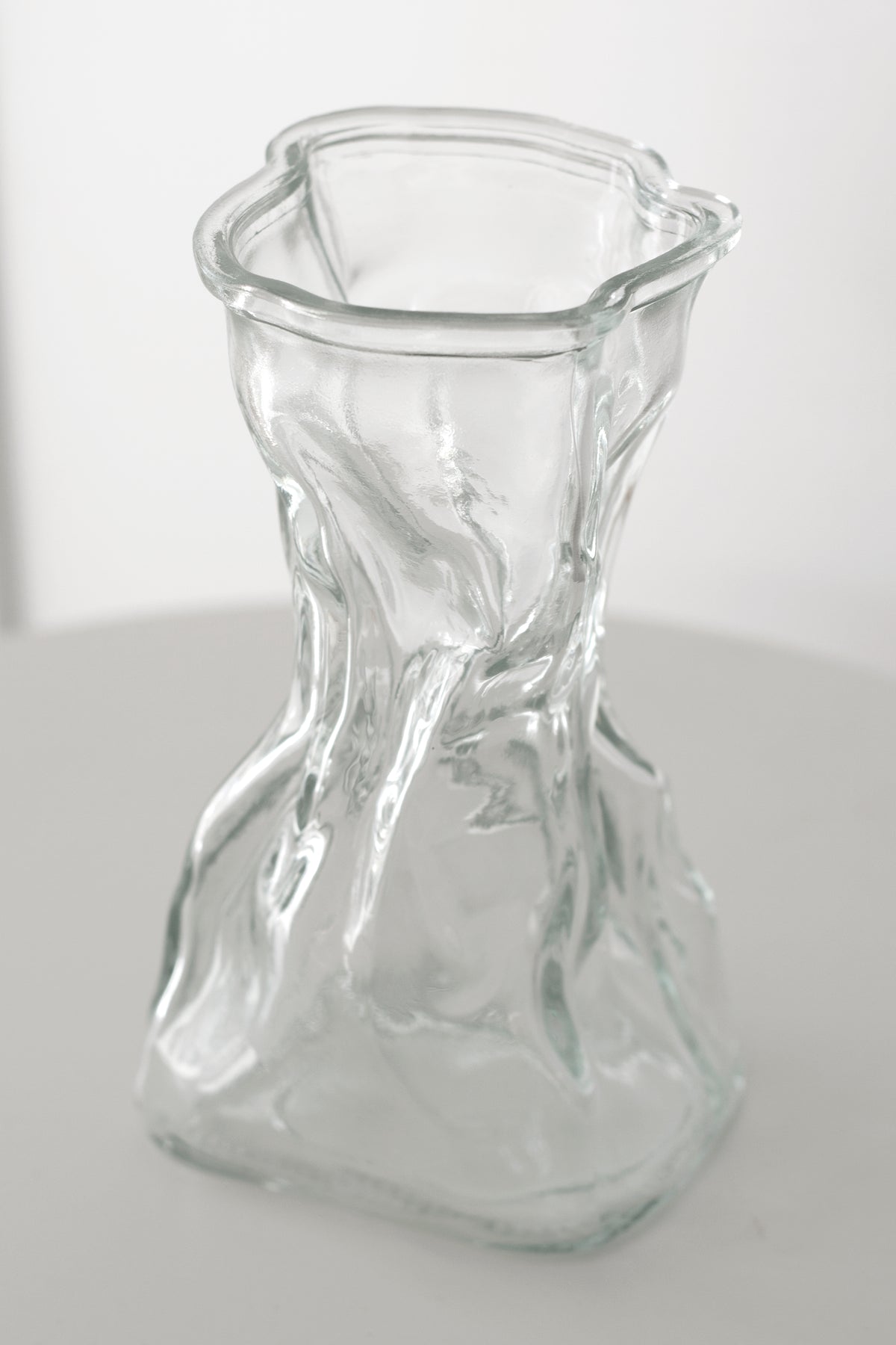 Clear crinkle vase from above, showing the crumpled rim and folded glass walls