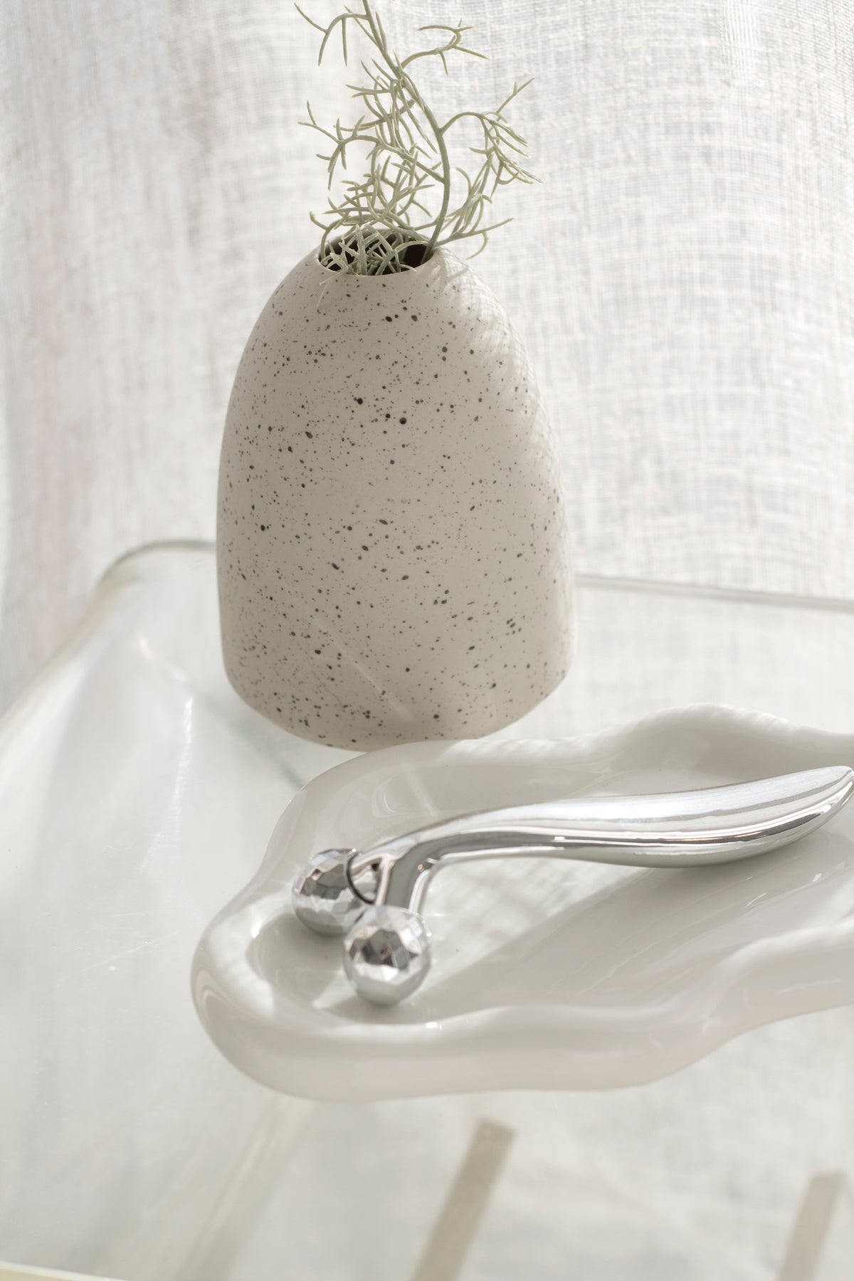 Little Rick Vase speckled natural ceramic styled on a shelf