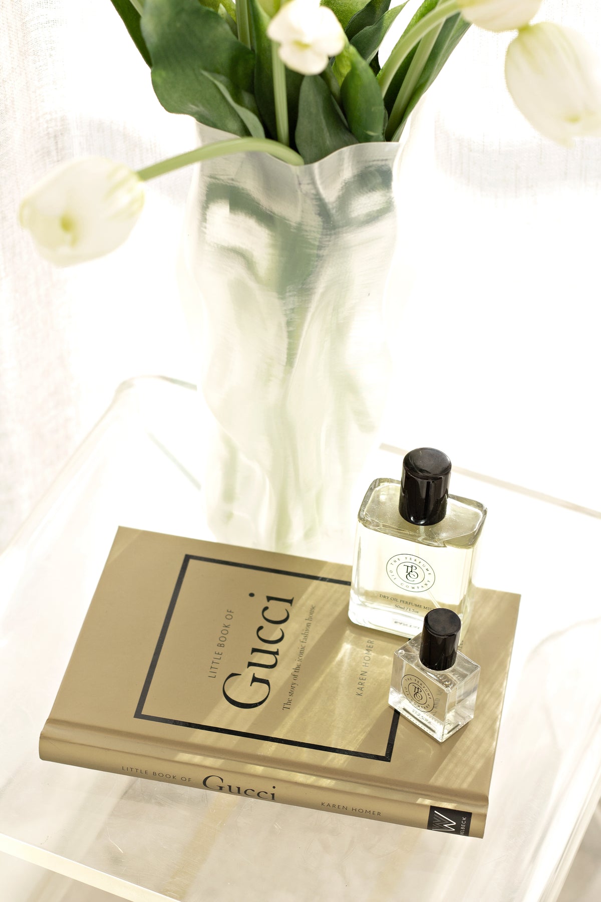 Little Book of Gucci styled on a shelf with neutral home decor