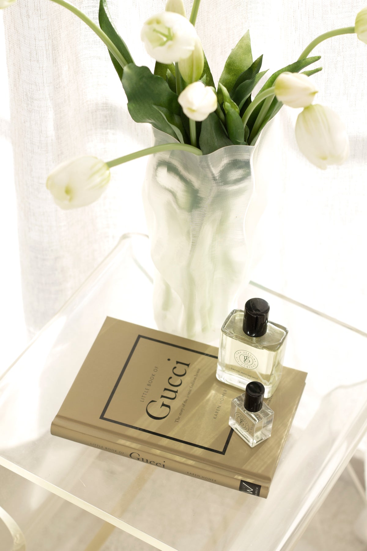 Little Book of Gucci styled on a console table