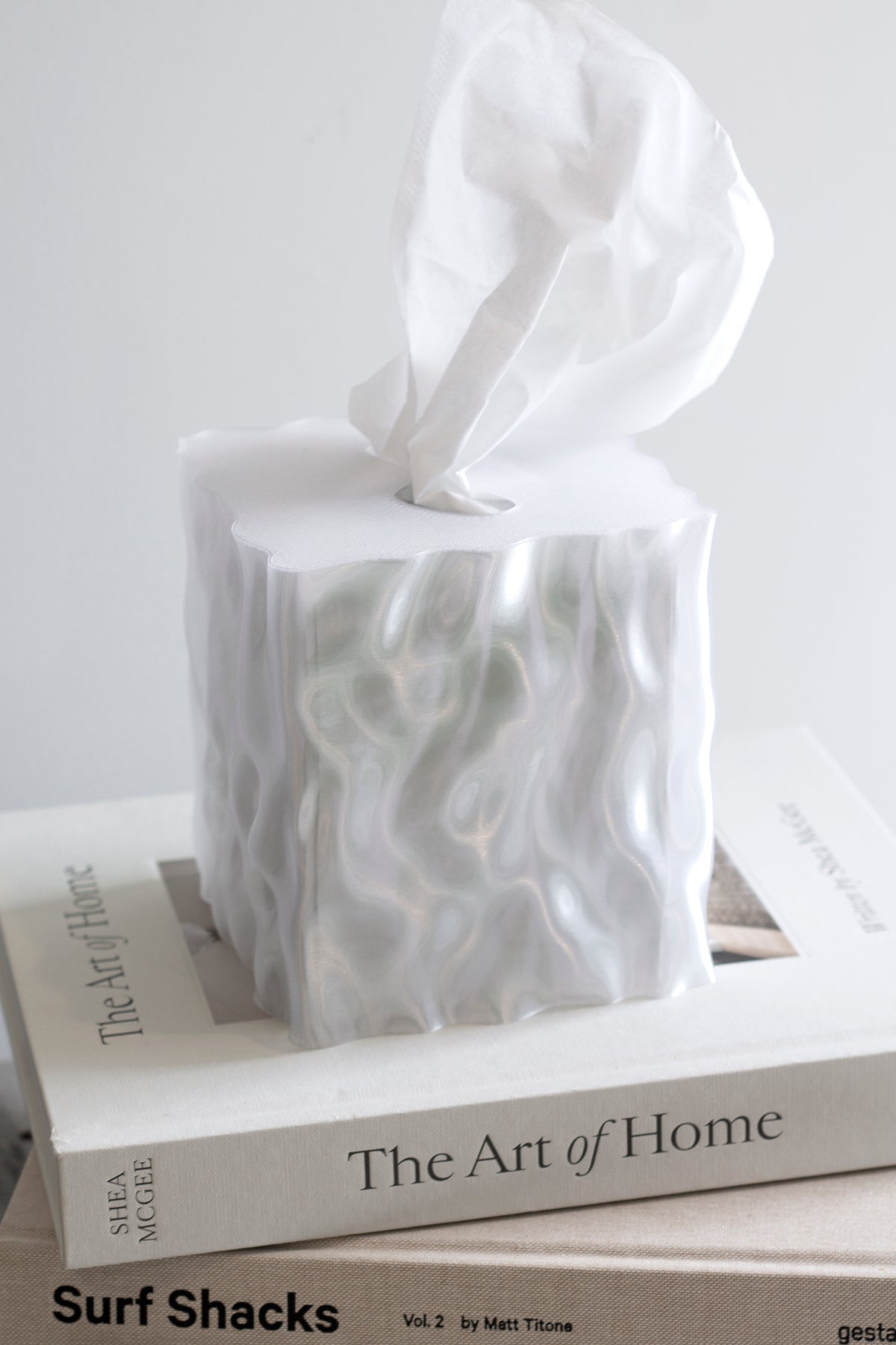 Close view of a white Flow cover on stacked books