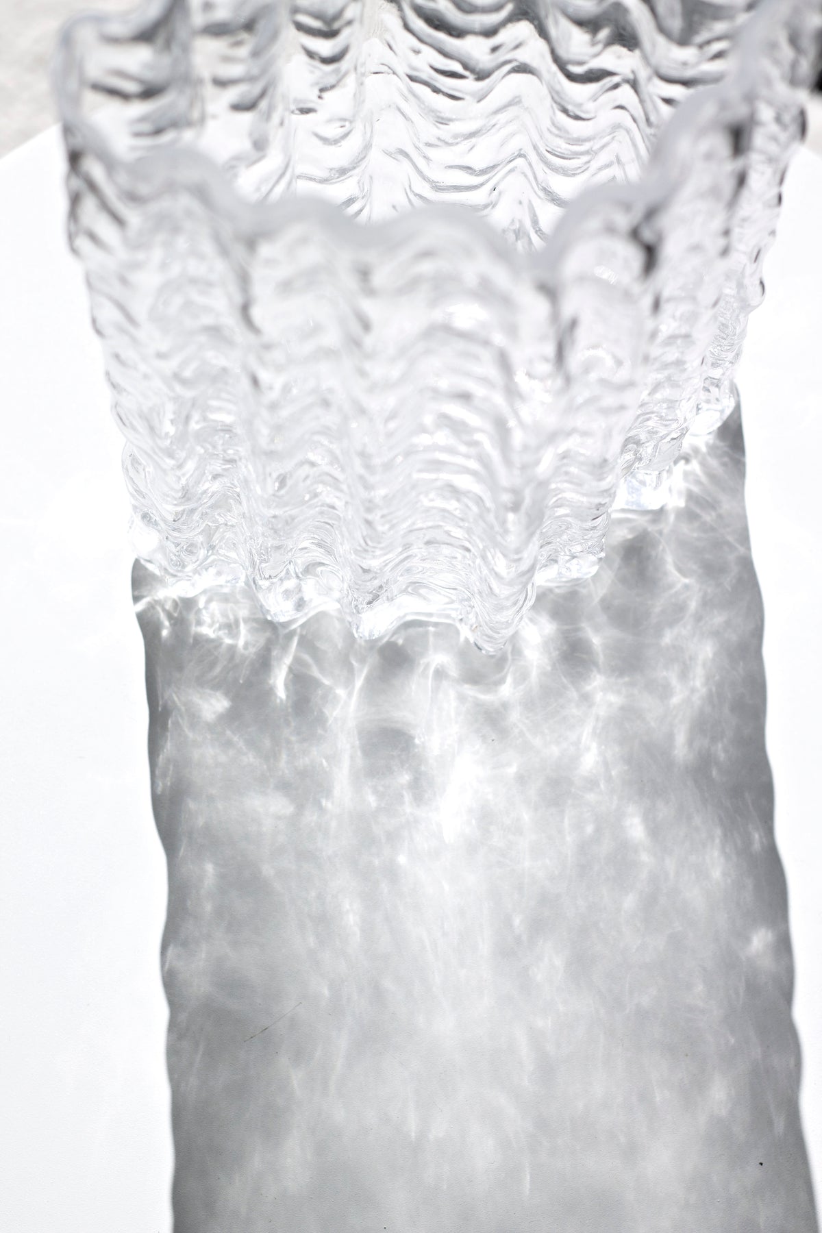 Close up of the clear Glacier vase wall with water visible through the rippled glass