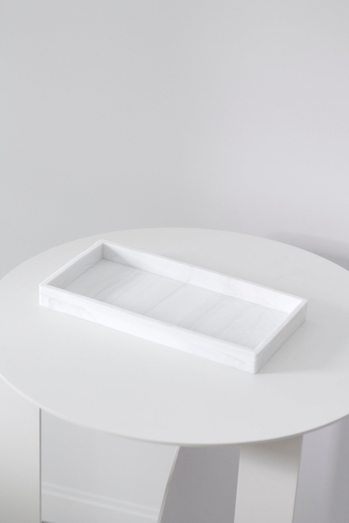 Marble-look silicone tray styled on a vanity