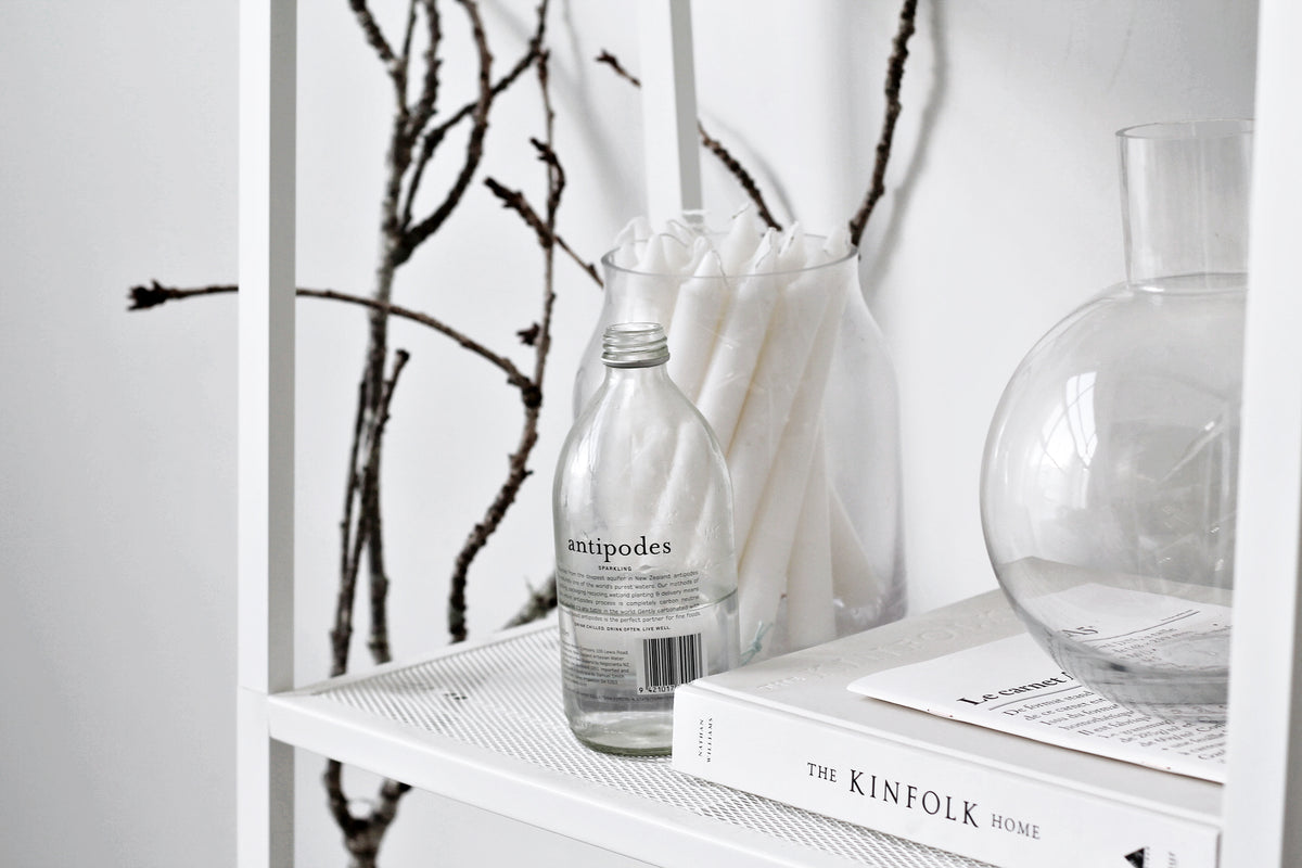 The Kinfolk Home book styled with a candle and vase