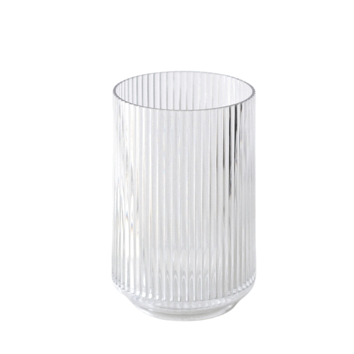 Clear fluted tumbler with fine vertical ribbing, shown empty on a plain white background