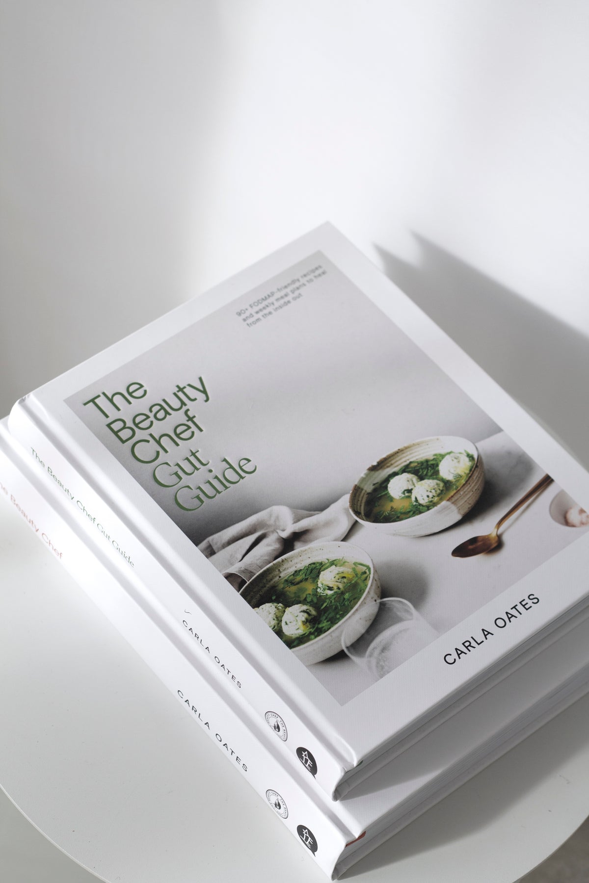The Beauty Chef Gut Guide page spread showing food photography