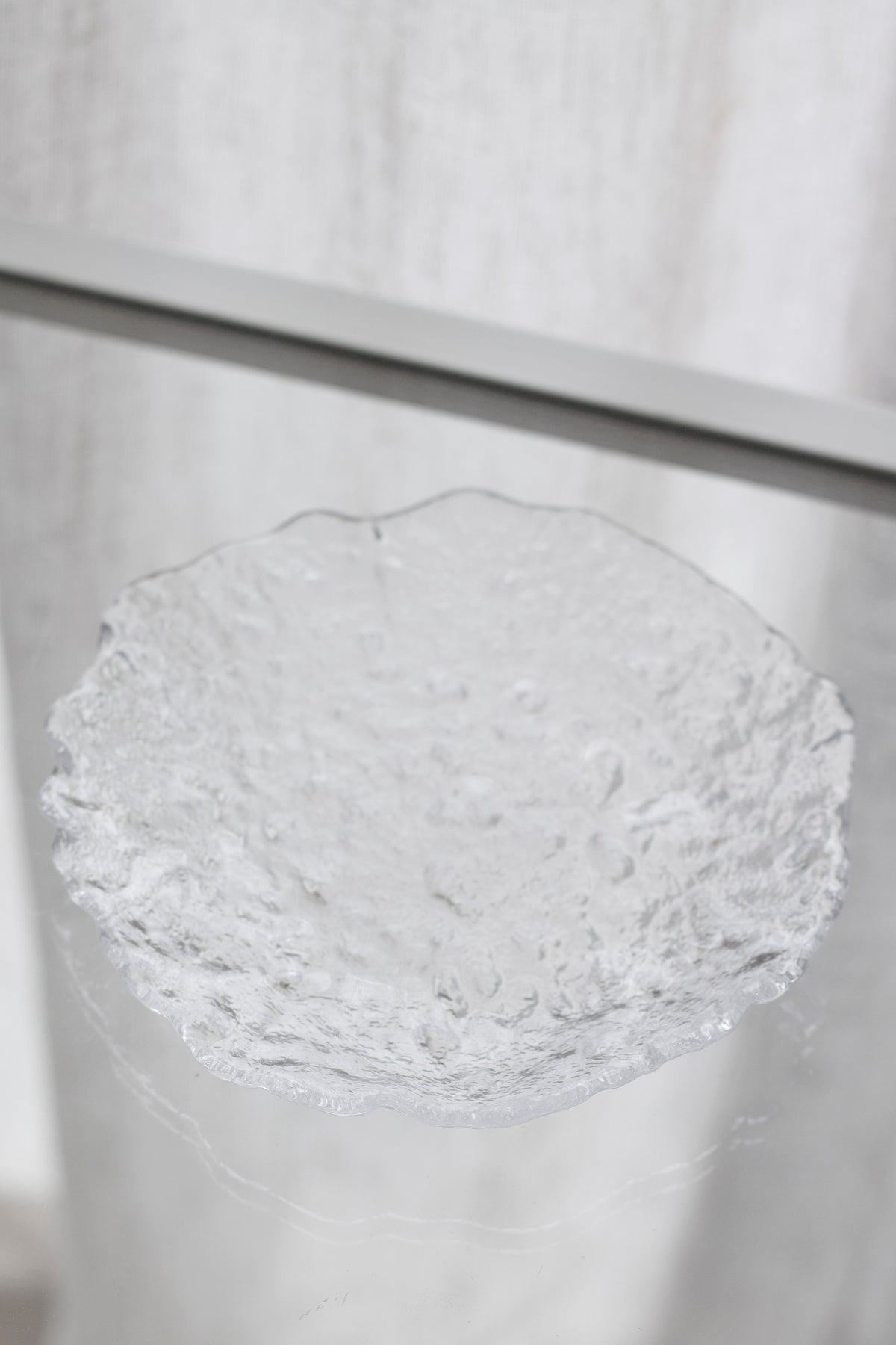 Glacier glass tray on a pale ledge, looking down into the bubbled dish
