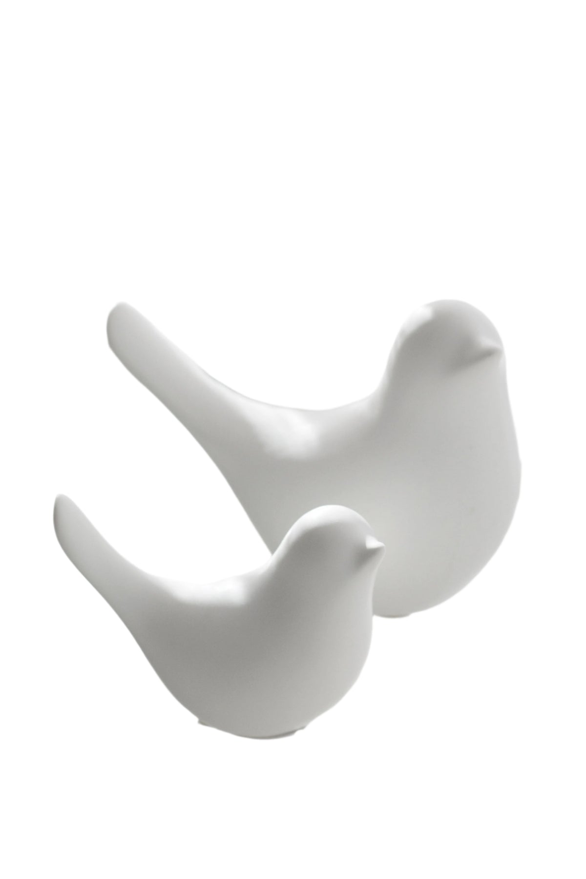 Della ceramic doves in matte white, small and large, on a white background