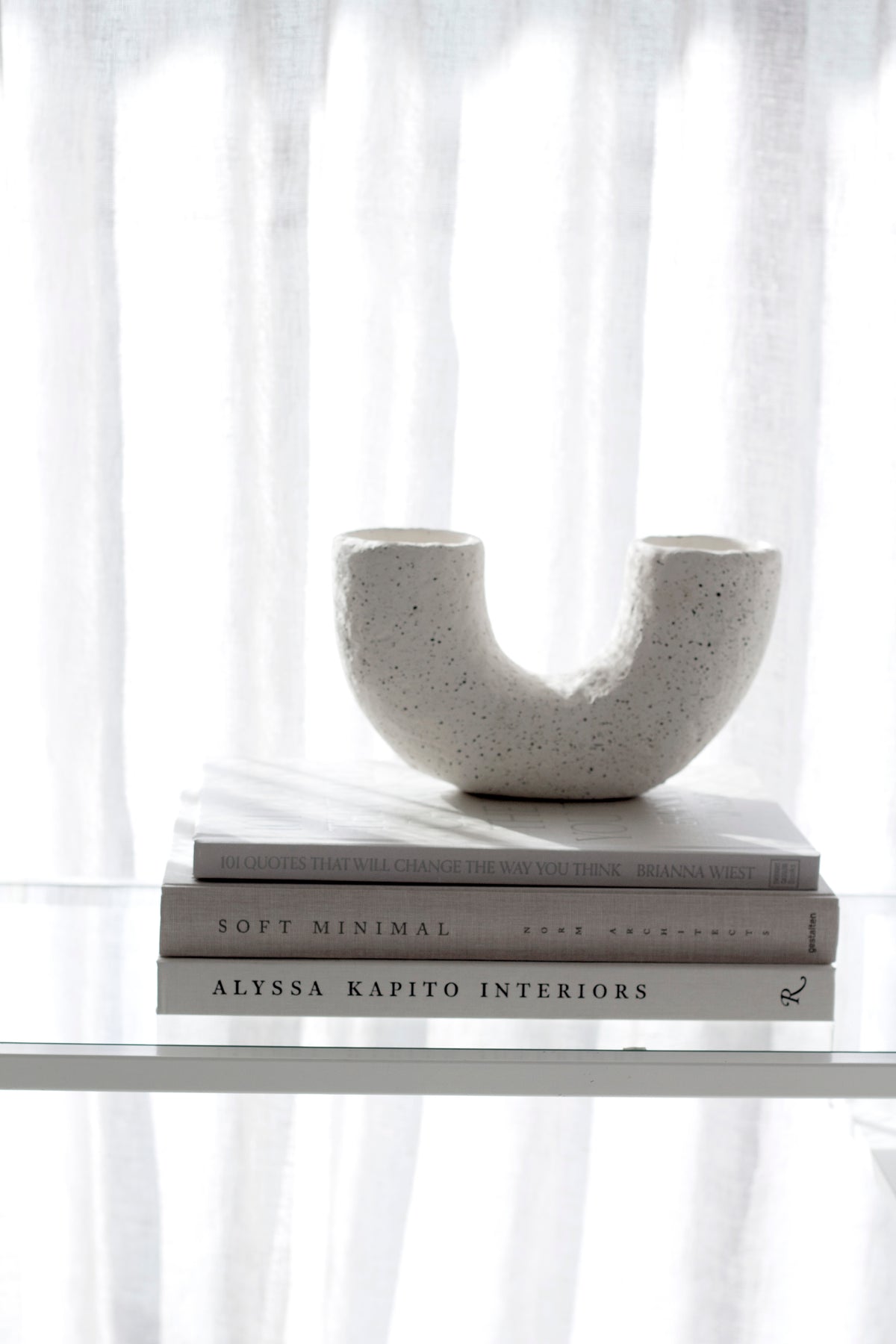 Alyssa Kapito Interiors page spread showing a neutral interior