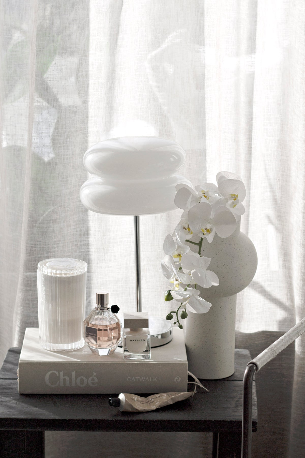 Kansas Vase styled with long stems on a console