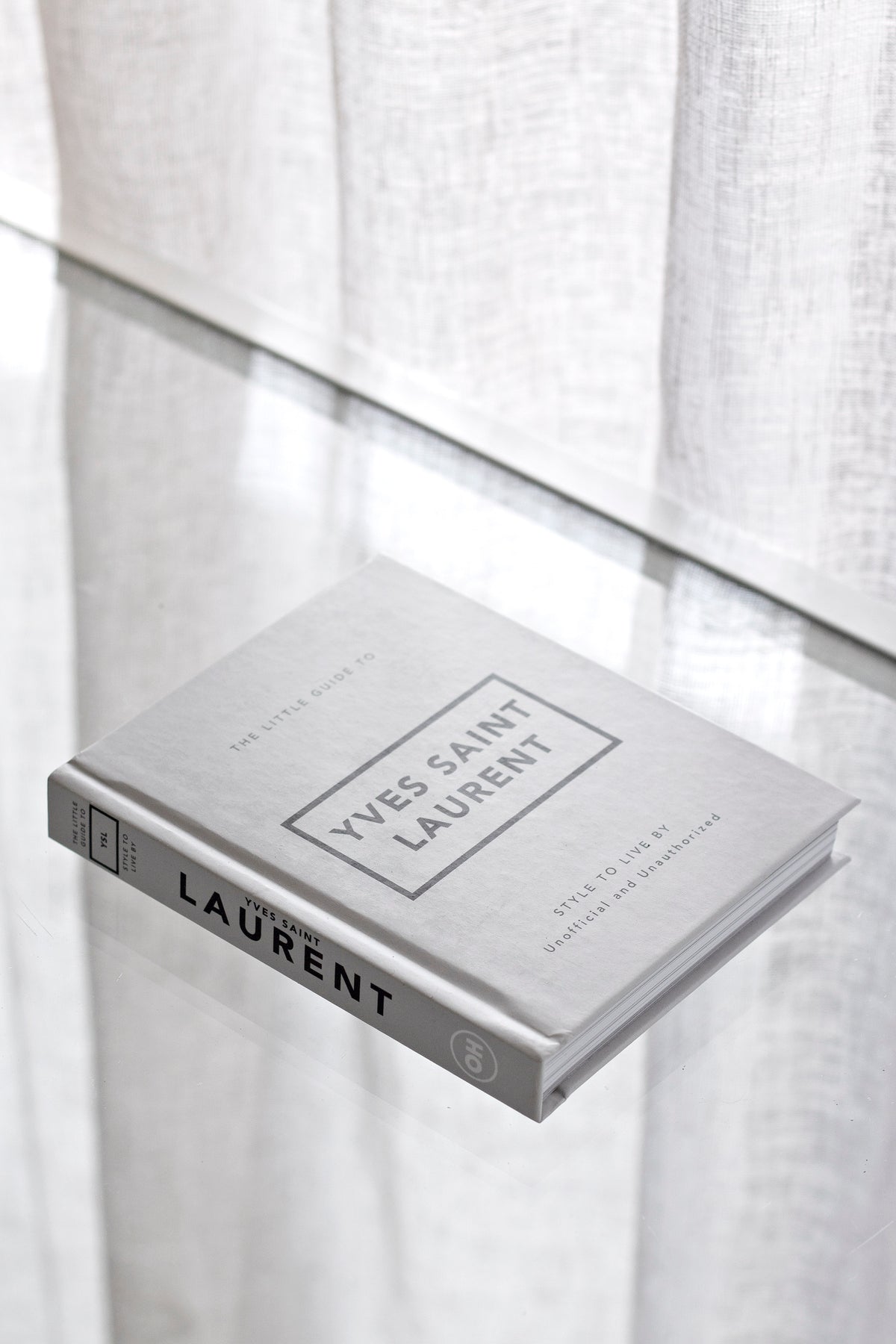 Little Guide to Yves Saint Laurent styled on a shelf
