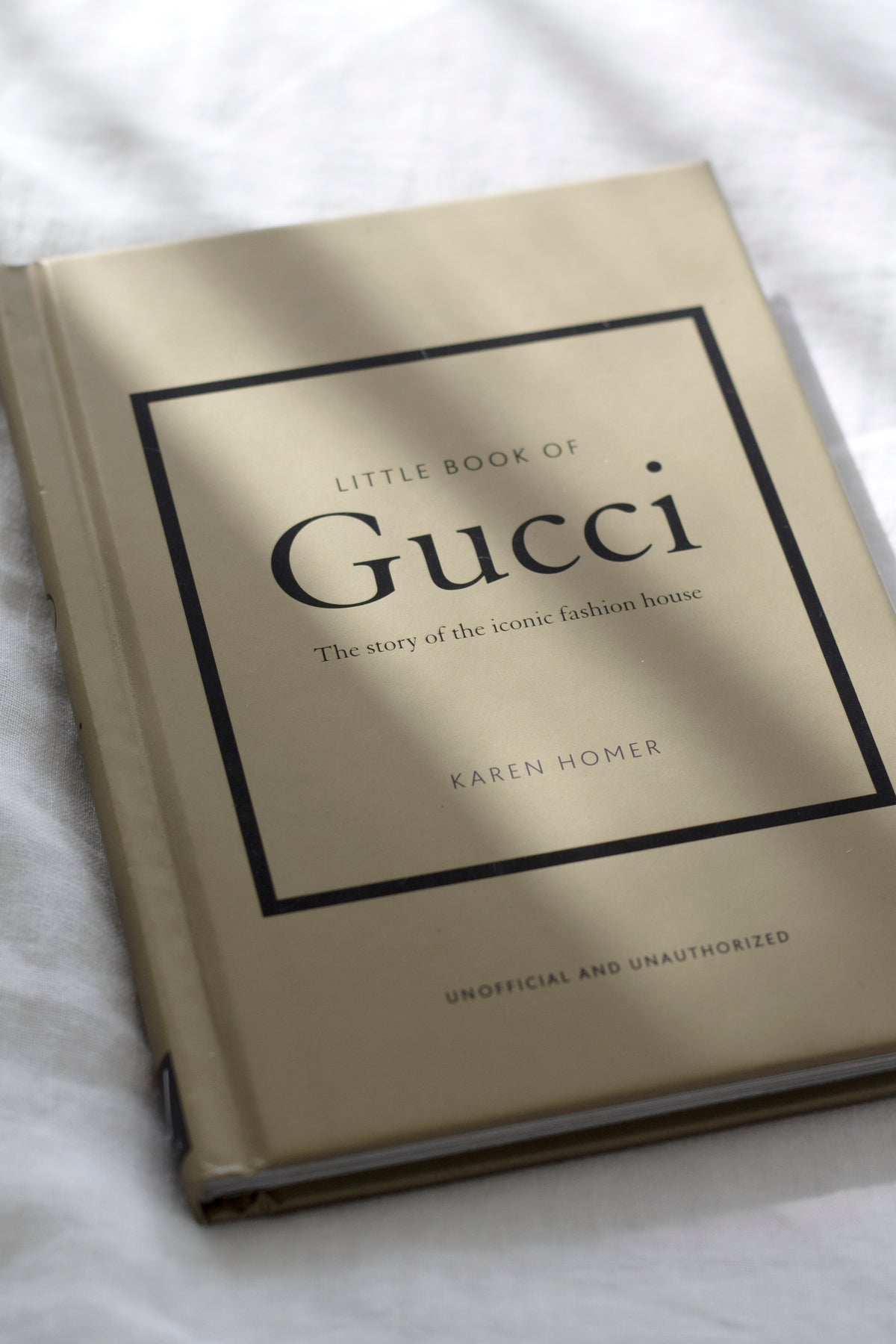 Little Book of Gucci styled with a vase and candle