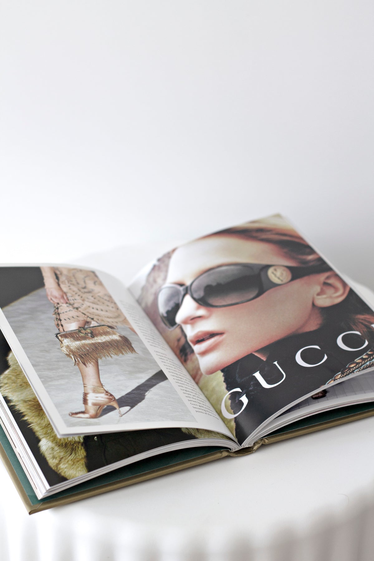 Little Book of Gucci styled on a coffee table with home decor