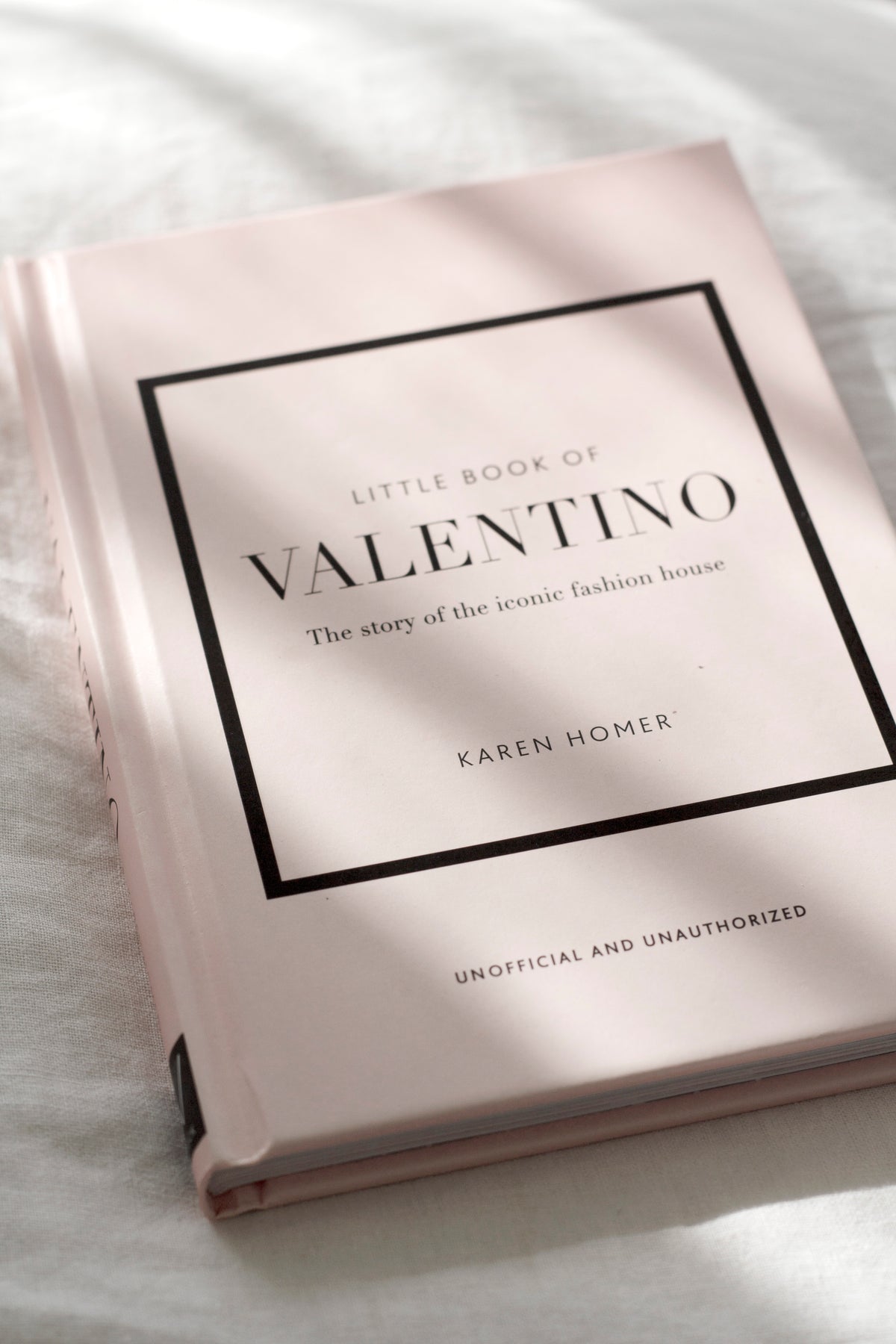 Little Book of Valentino styled on a console table