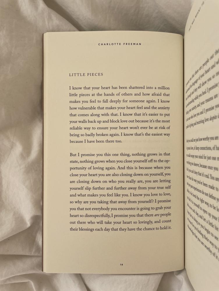 A "This Was Meant To Find You (When You Needed It Most)" book open on a bed with text on it.
