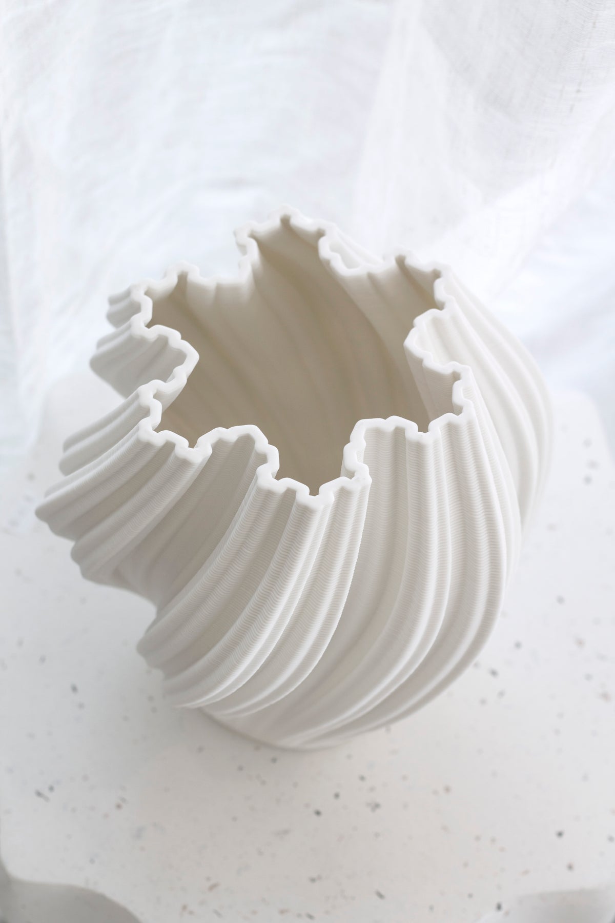 Close up of the empty white Amelie fluted vase from above, showing the rippled opening
