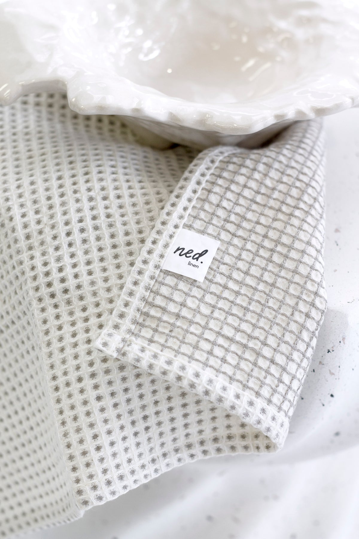 Lunar Tea Towel styled with wooden boards and ceramics