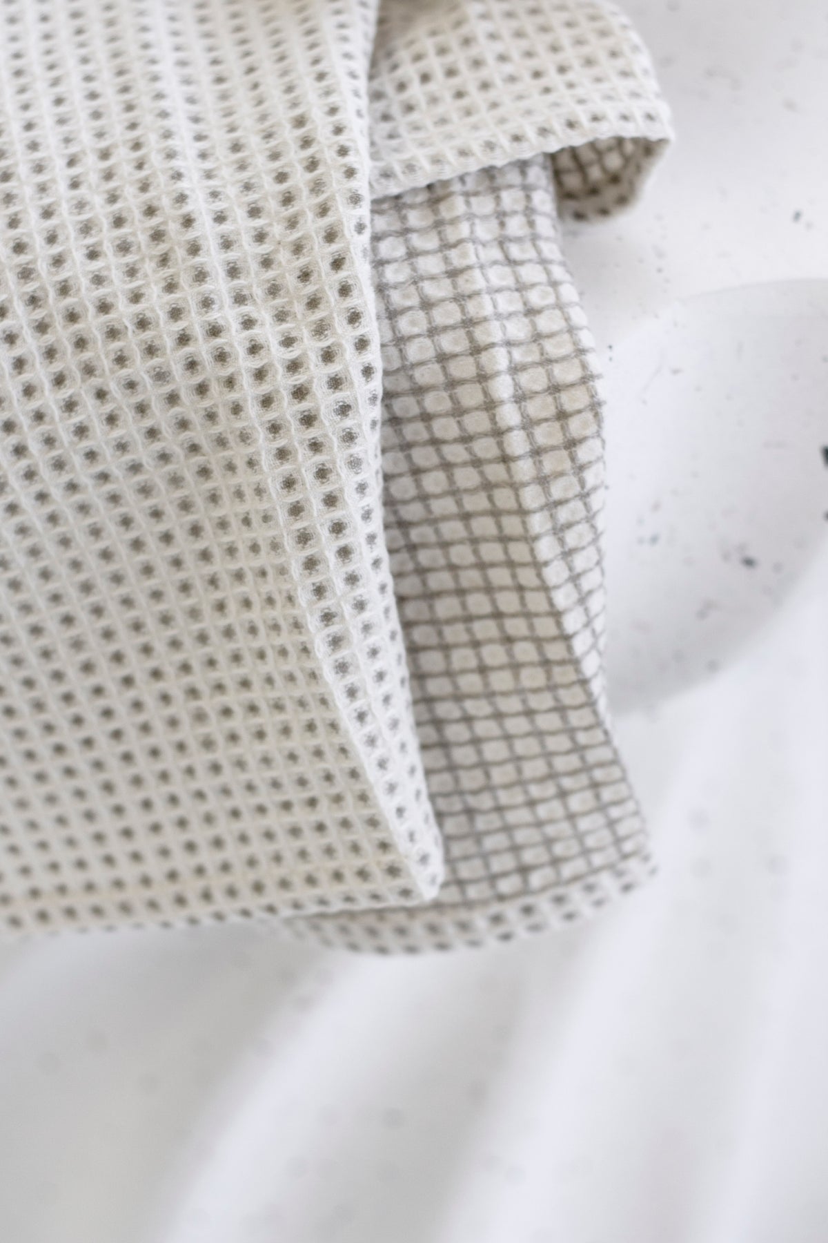 Lunar Tea Towel wrapped around a bottle of olive oil as a gift
