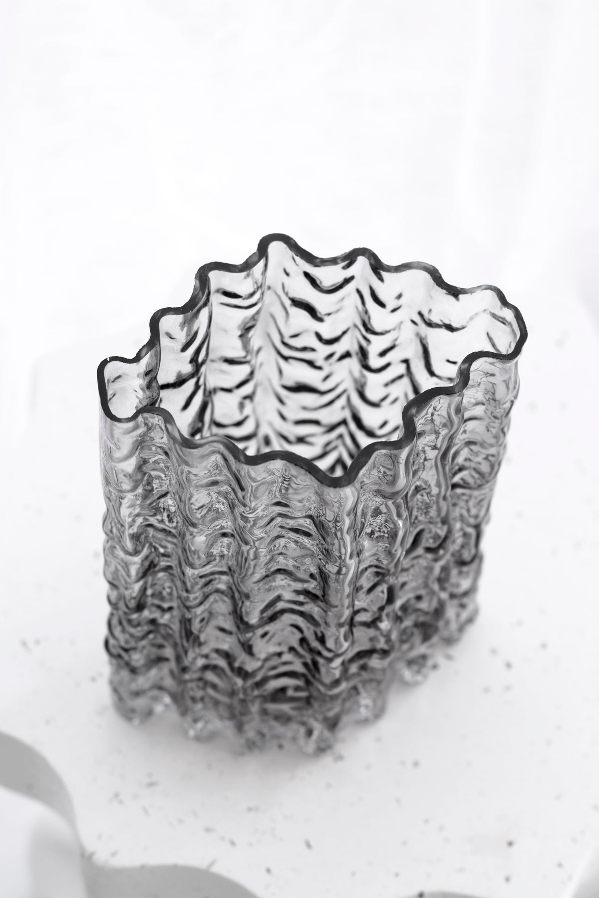 Smoke Glacier vase from above, its grey tinted rim catching soft light