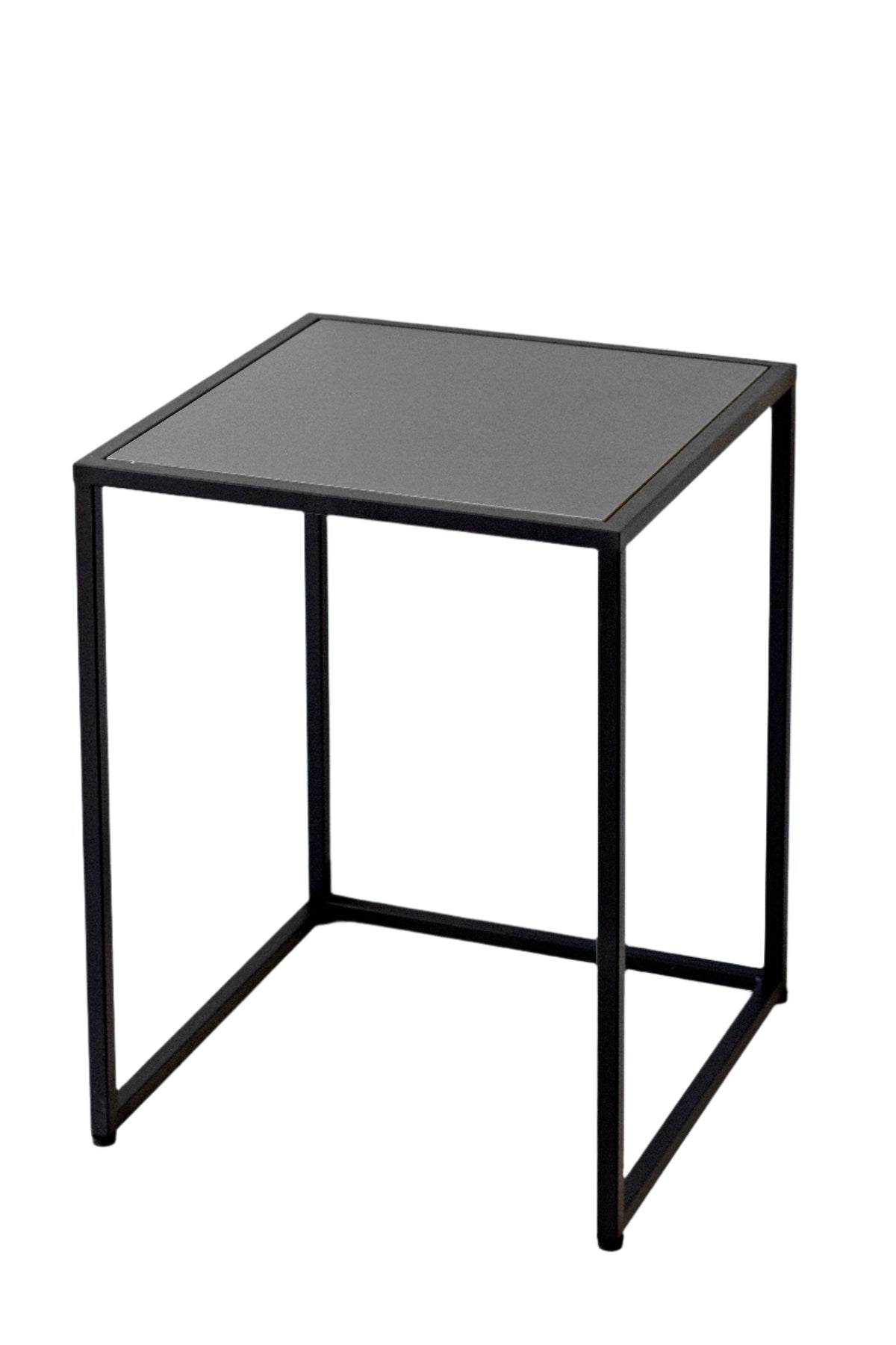 Sara bedside table shown front on, the black frame and recessed dark top against a white background