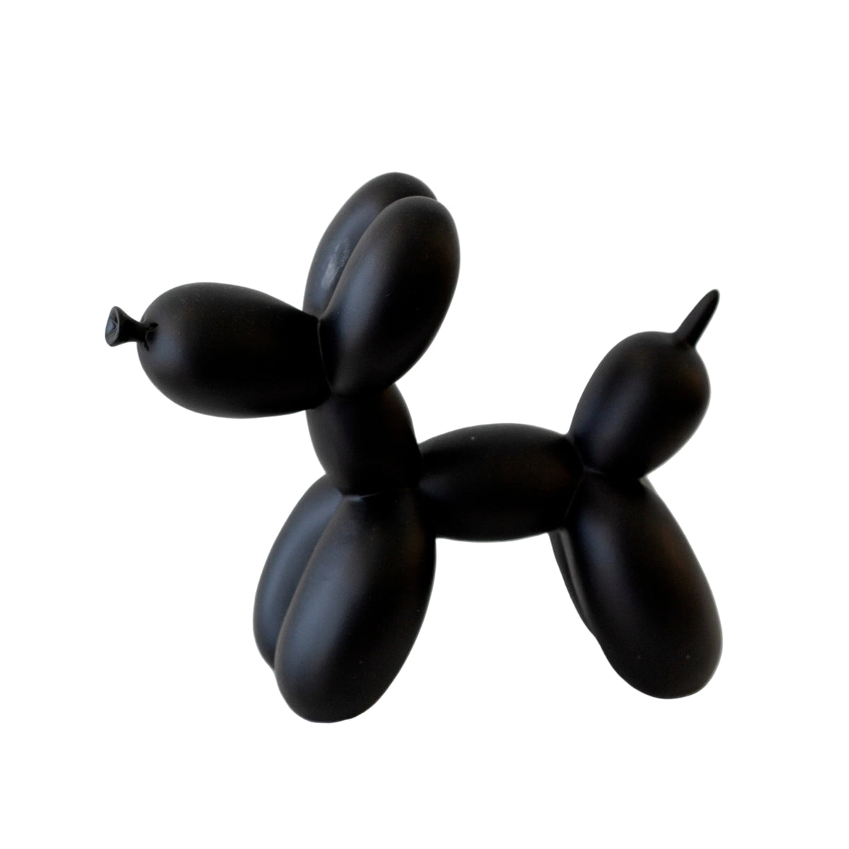 Black ceramic balloon dog sculpture on a white background