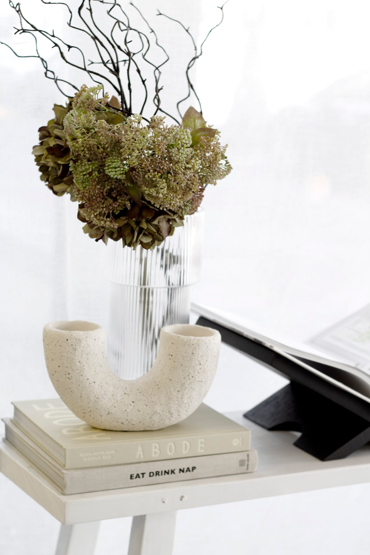 Eat Drink Nap Soho House book styled on a shelf