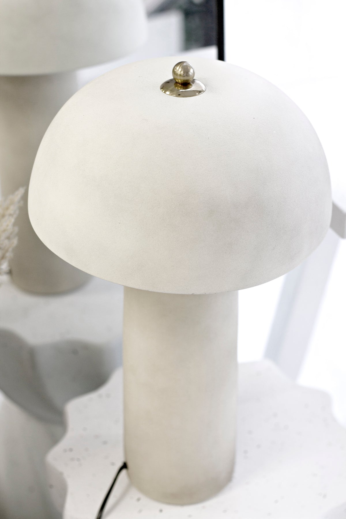 Xander lamp on a white table, close view