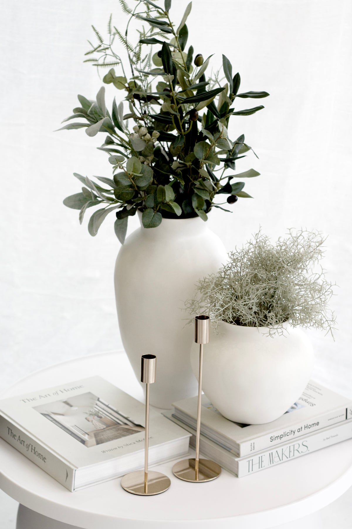 Venus Vase styled on a console with books and candles