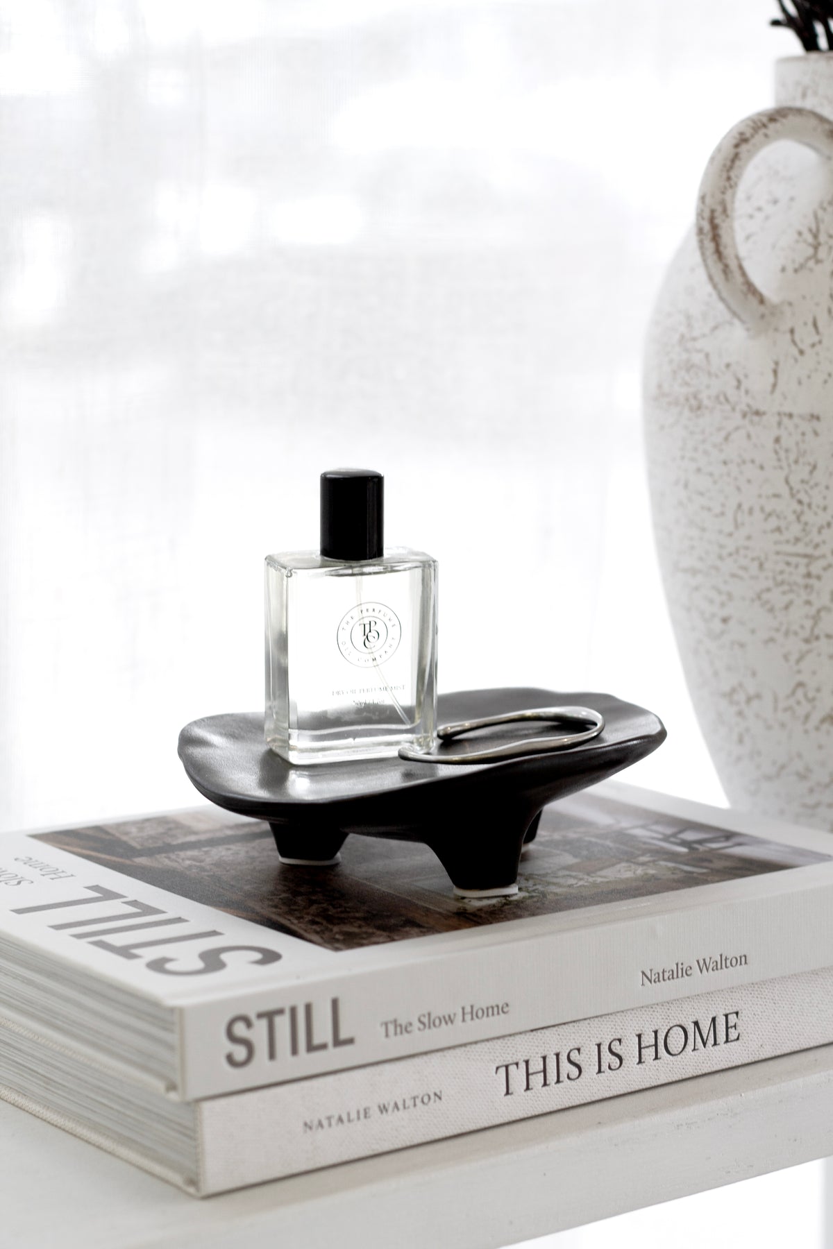 Still The Slow Home book styled on a neutral surface