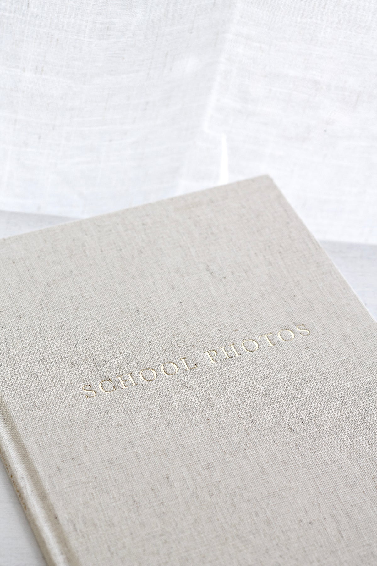 School Photo Archive Journal cover detail showing woven linen and gold foil