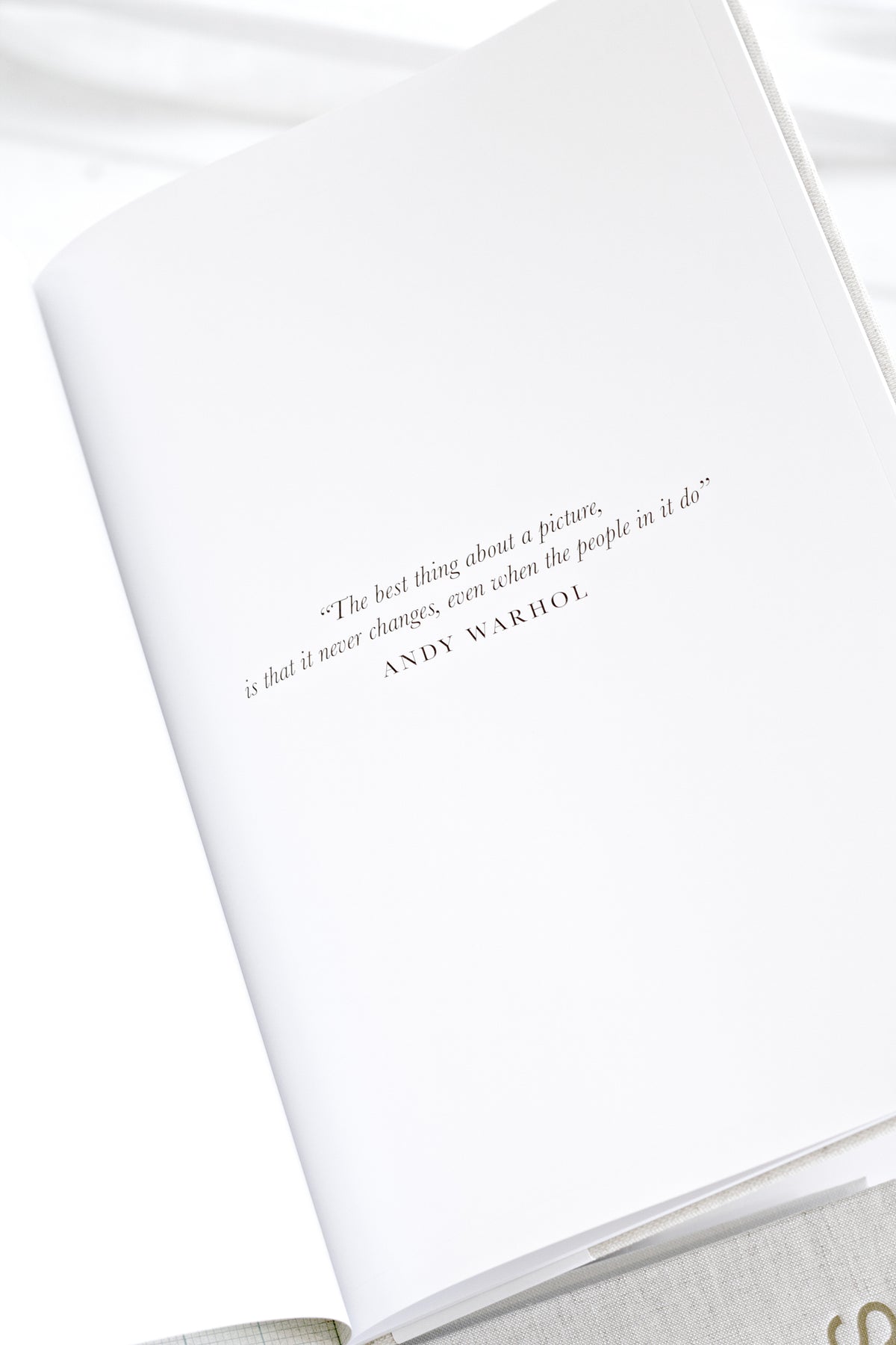 School Photos journal open to a printed quote page, angled view