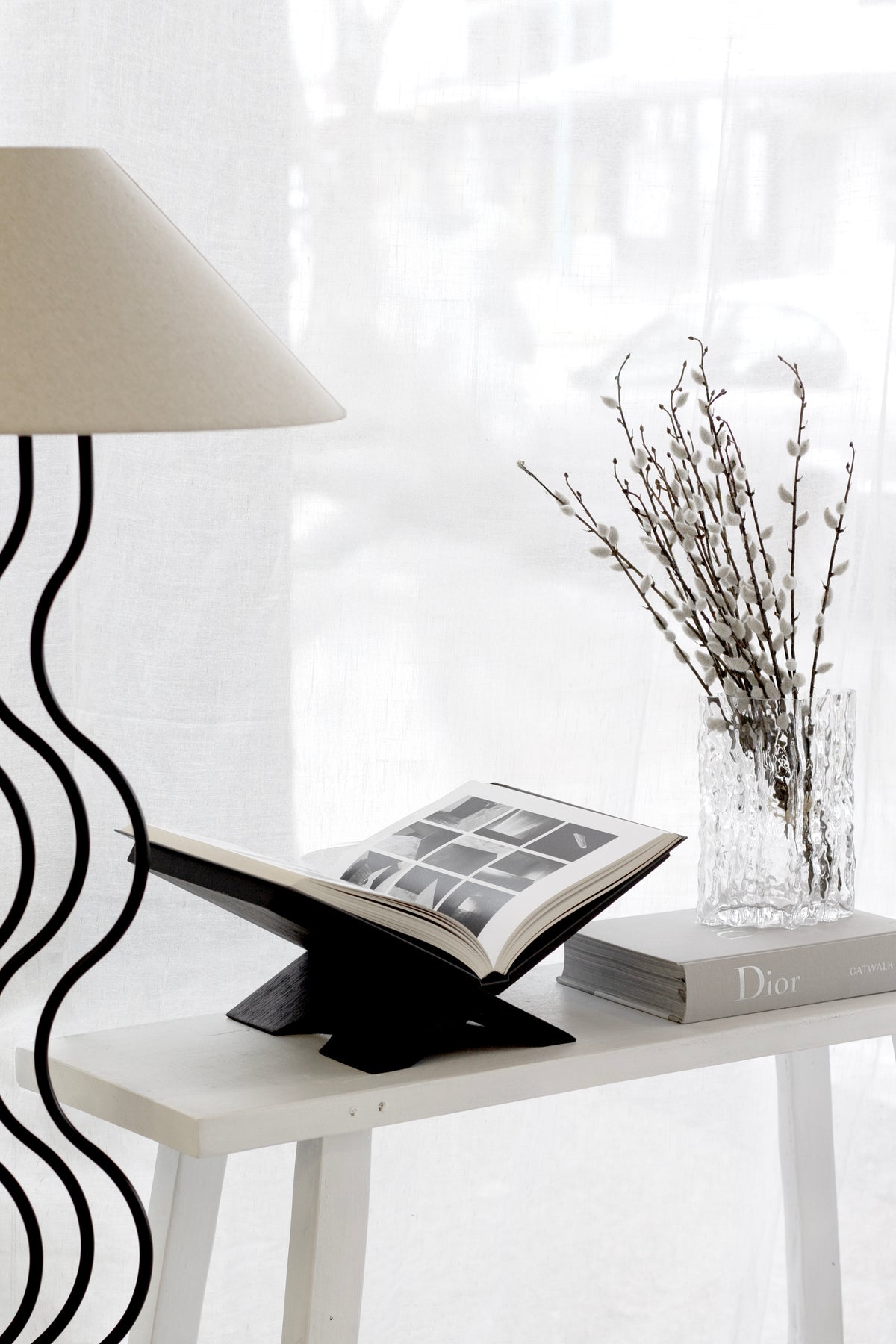 Dior Catwalk book styled with sculptural decor