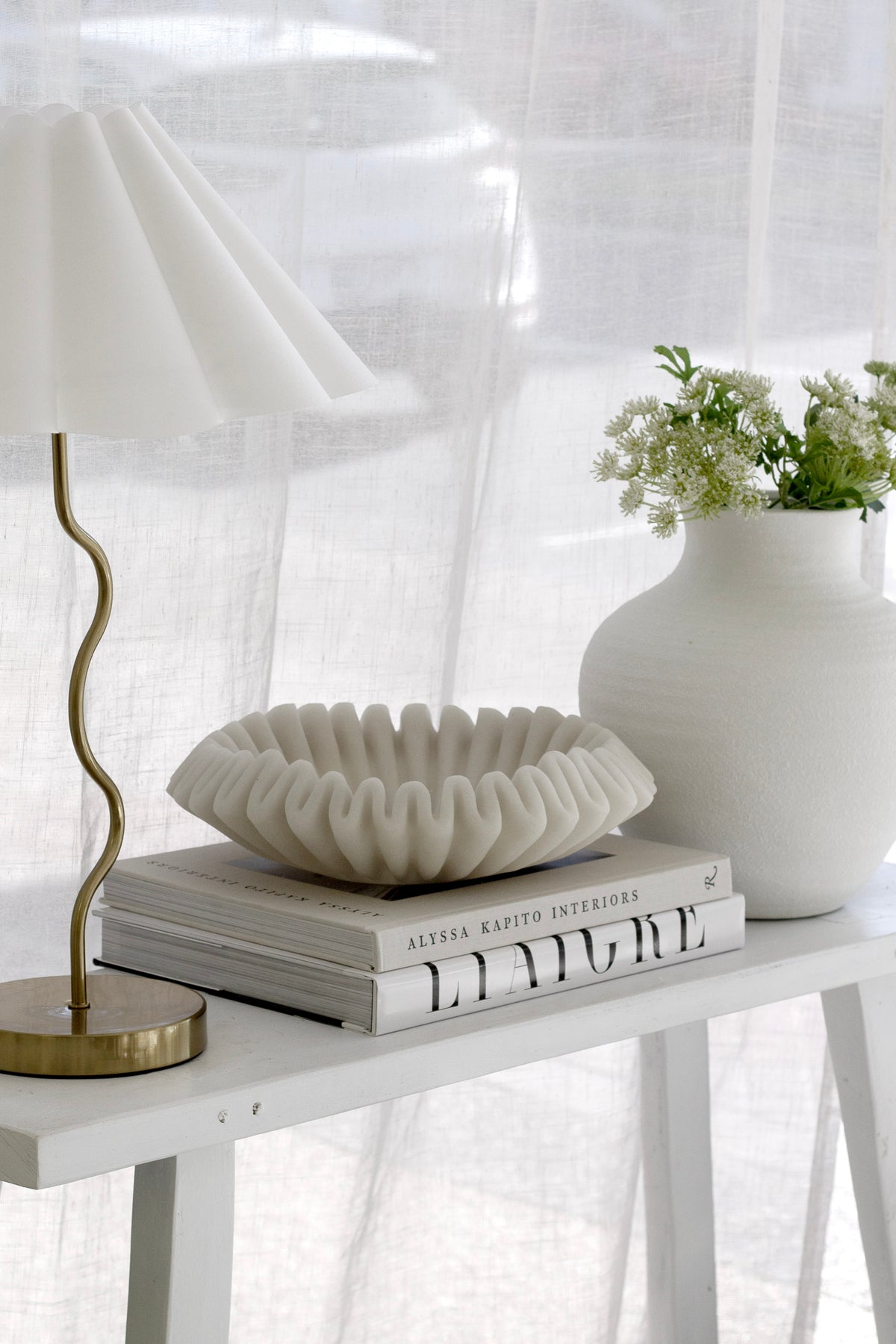 Liaigre 12 Projects page spread showing refined furniture