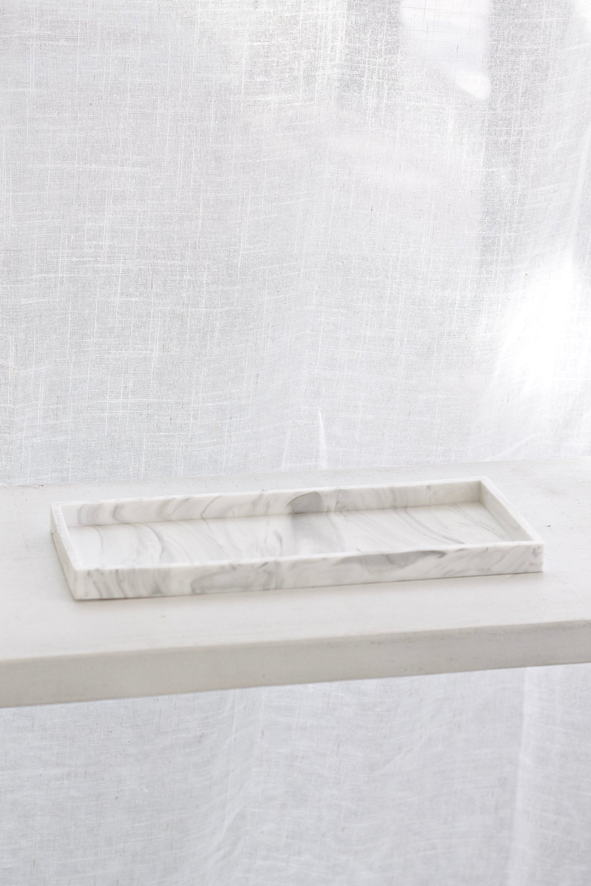Marble-look silicone tray with soft grippy finish