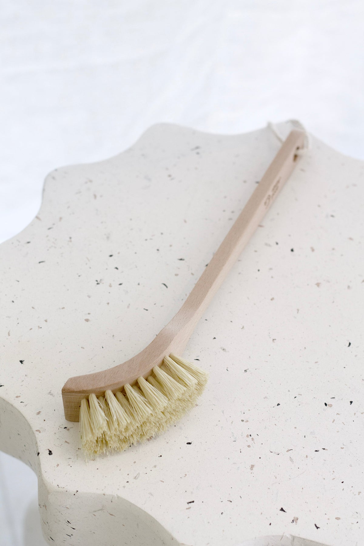 Wooden dish brush displayed in store at Flux Boutique, Mount Maunganui