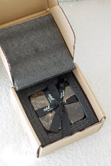 Stone Coasters – Natural Travertine & Dark Marble Set of 4 by Ned Collections