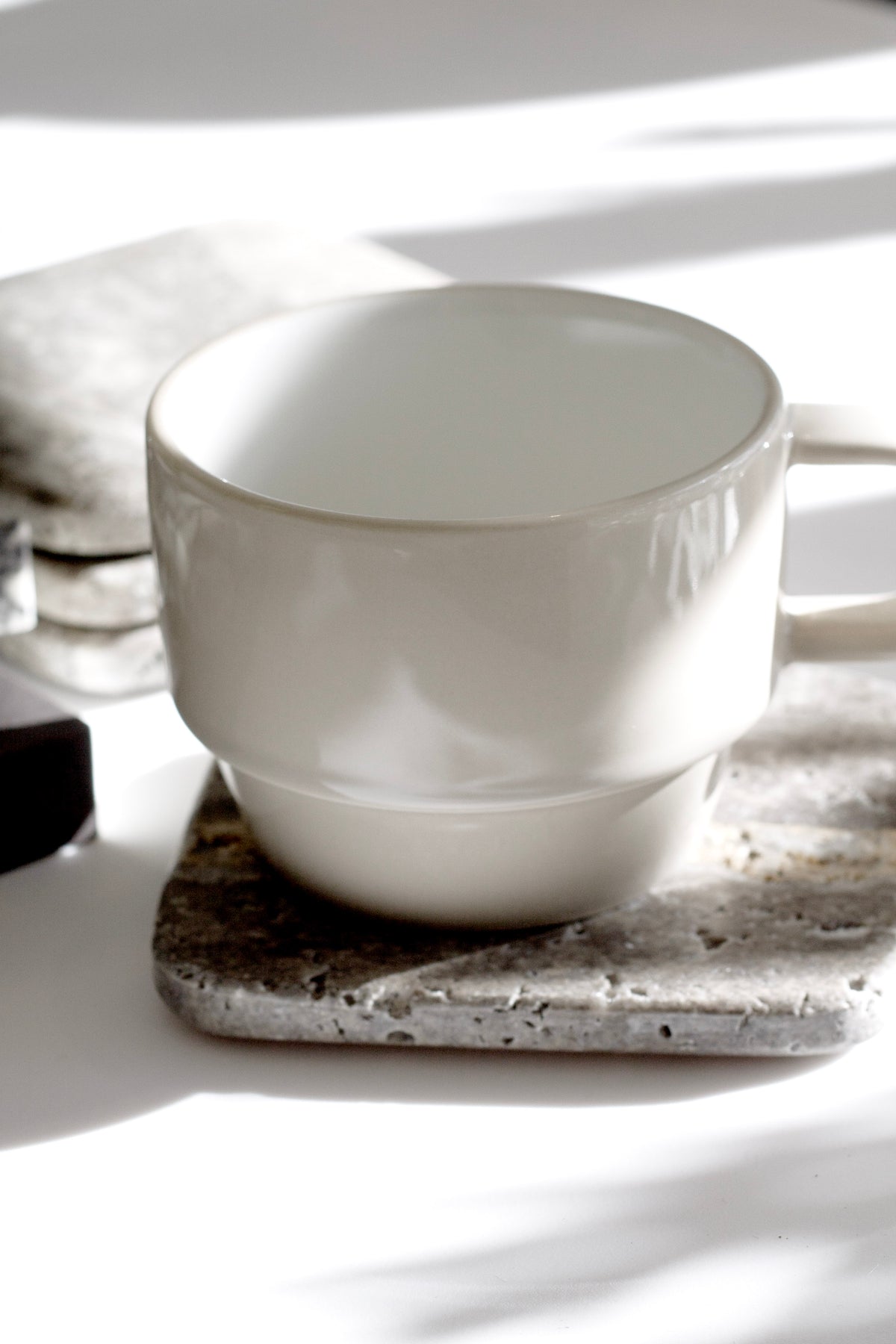 Hudson Mugs stacked on open shelving in a kitchen