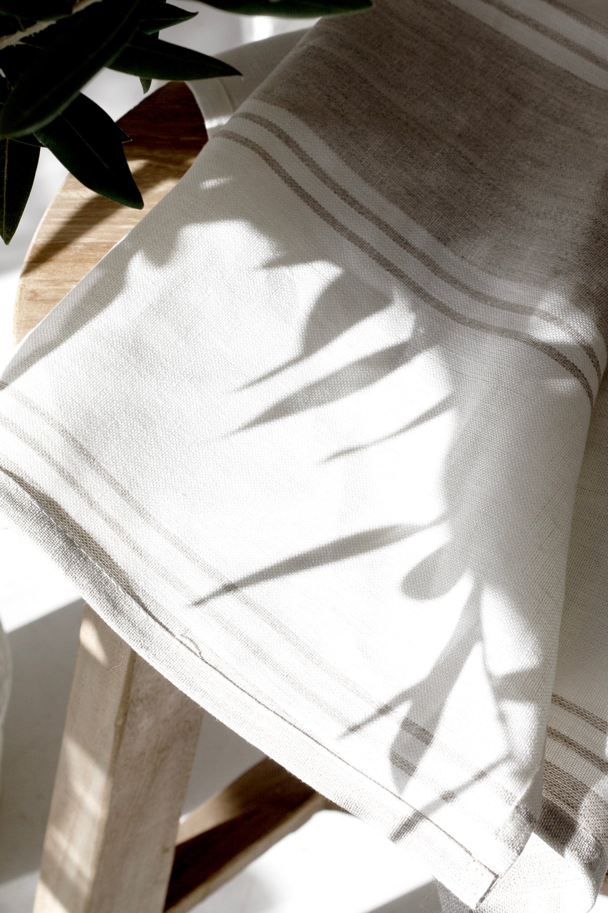 Nest Linen Tea Towel styled with ceramics for a relaxed kitchen look