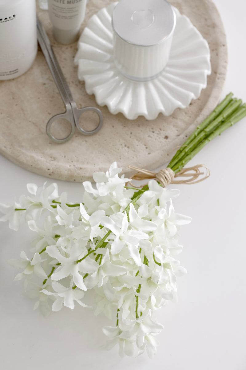 White flowers on a white surface with a neutral background
