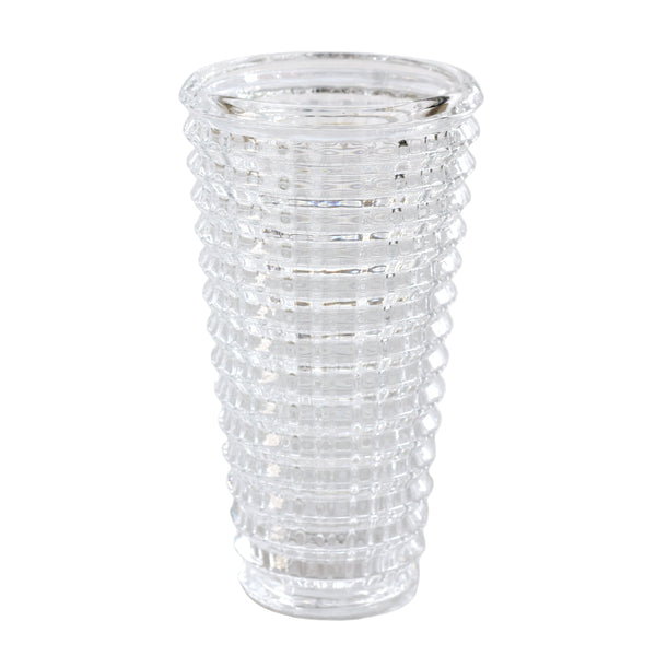 Clear glass vase with textured design on a white background