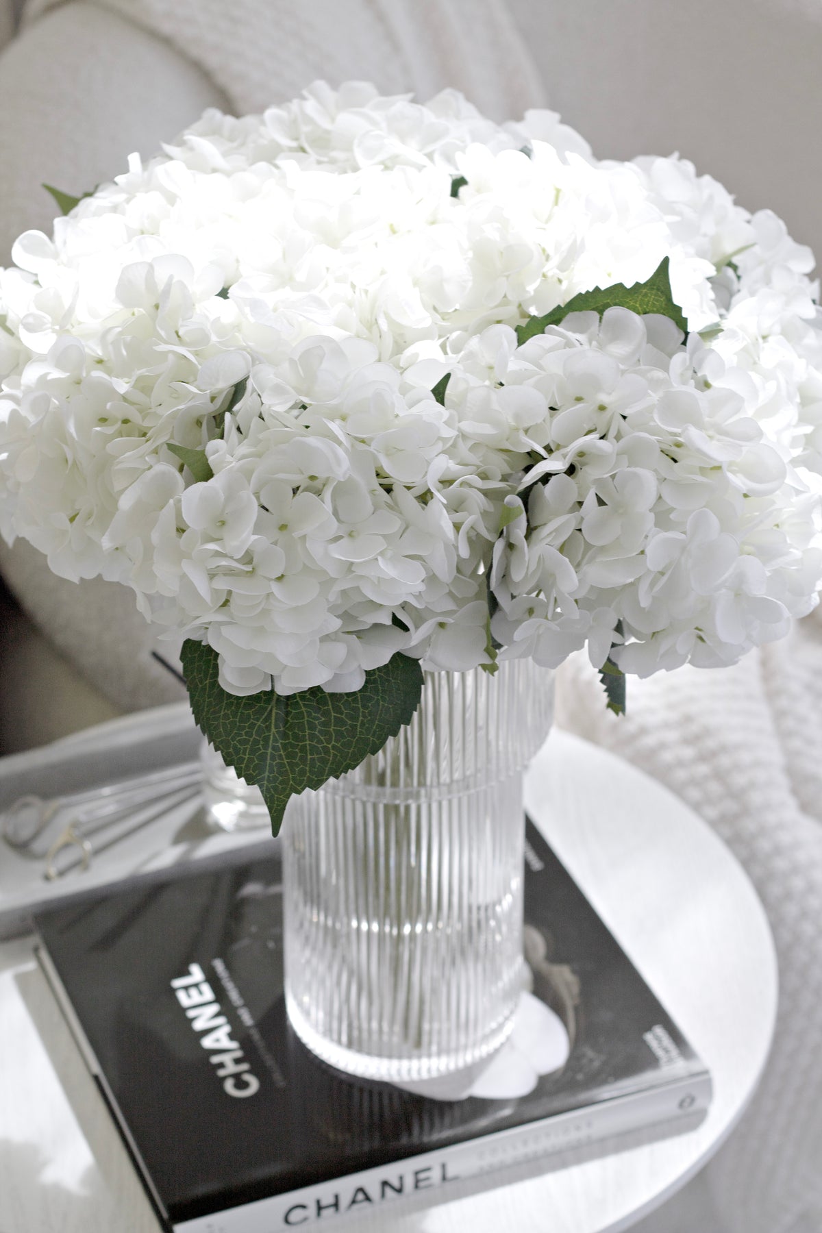 Chanel Collections and Creations book styled with home decor